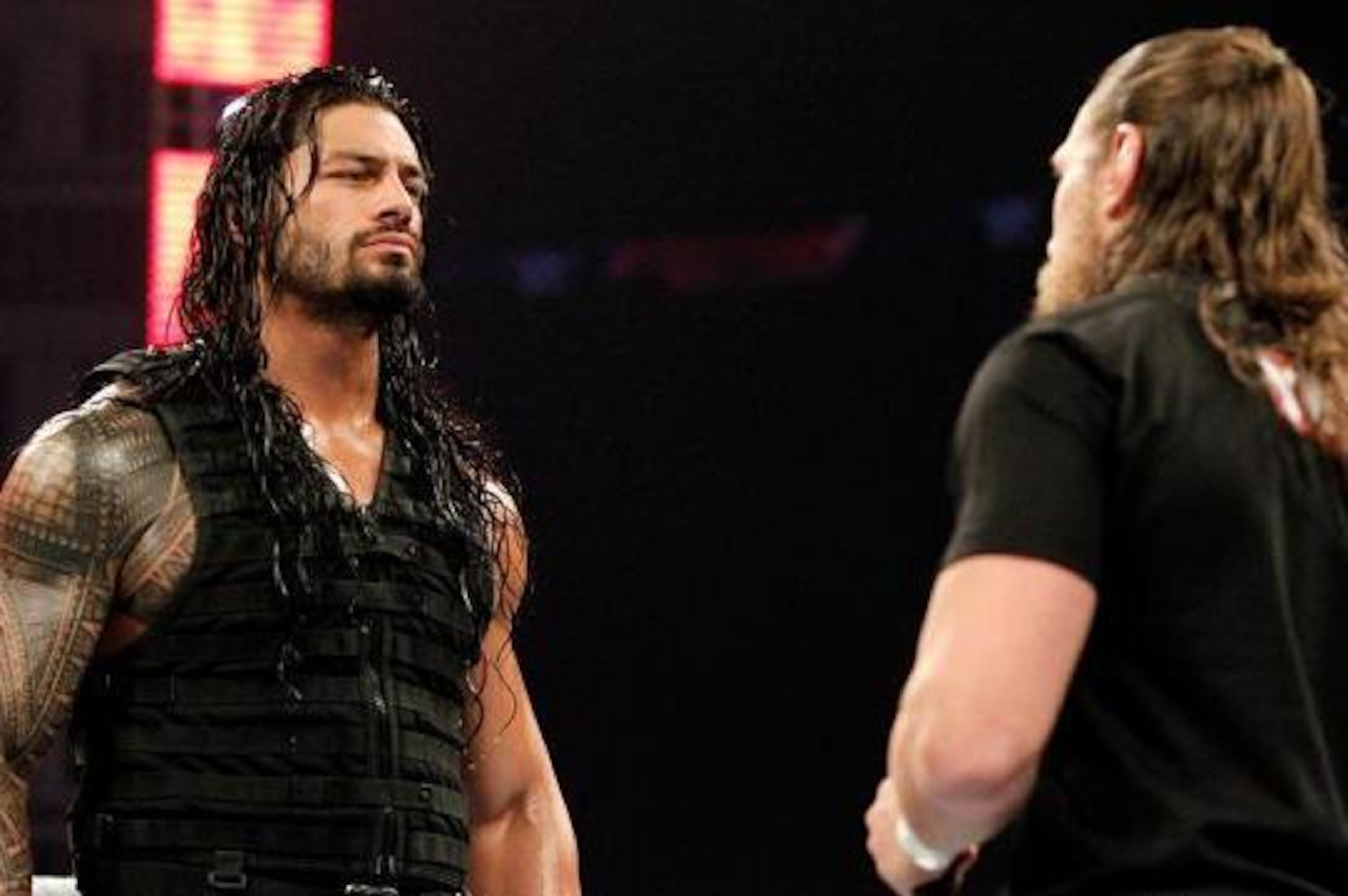 Roman Reigns stares down Daniel Bryan.