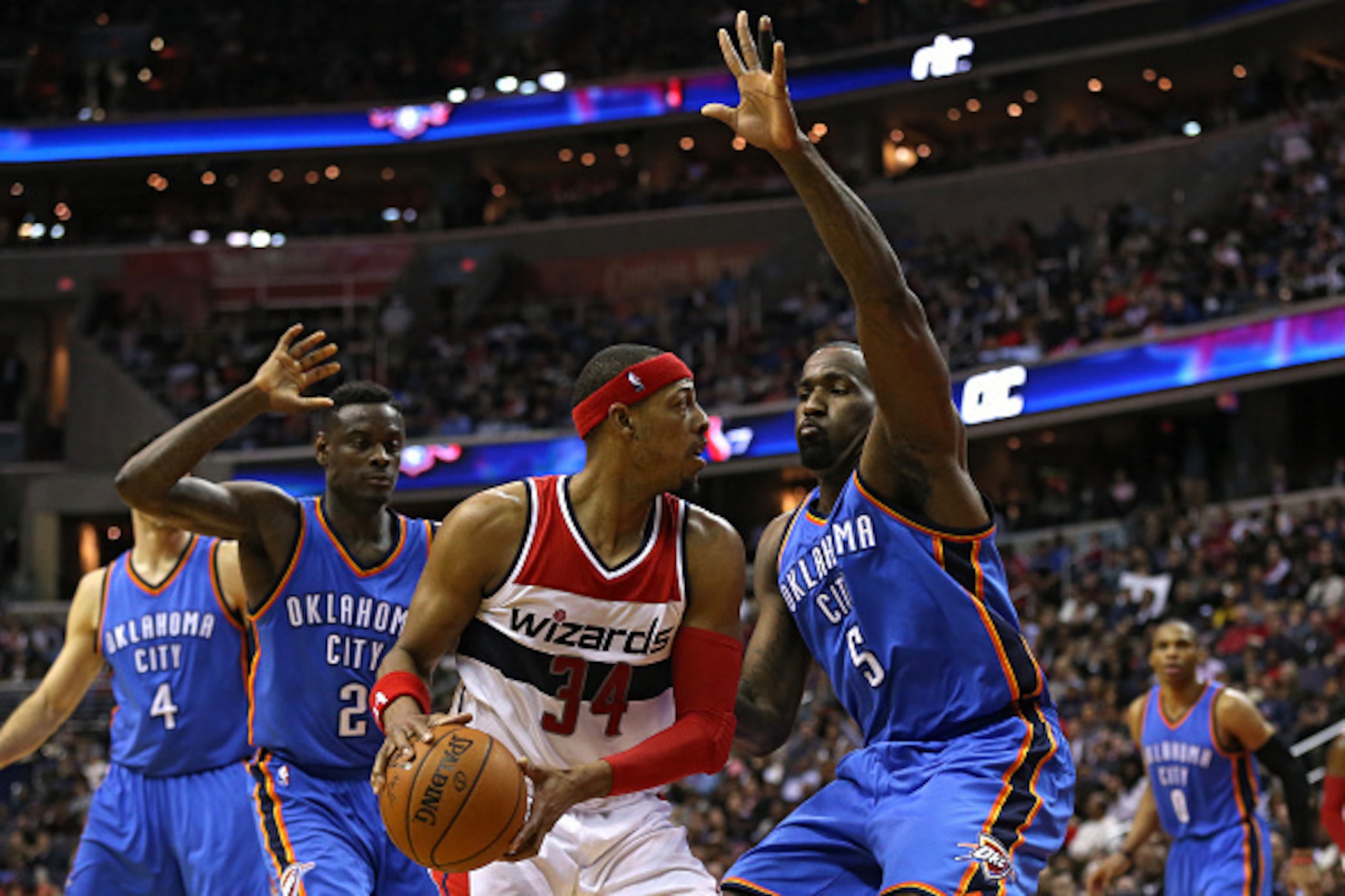 WASHINGTON, DC - JANUARY 21: Paul Pierce #34 of the Washington Wizards is defended by Kendrick Perkins #5 of the Oklahoma City Thunder and teammates in the second half at Verizon Center on January 21, 2015 in Washington, DC. The Oklahoma City Thunder won,