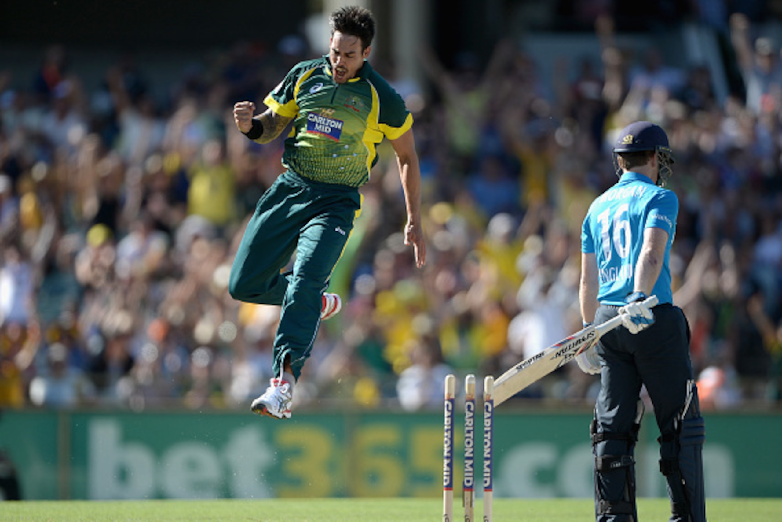 PERTH, AUSTRALIA - FEBRUARY 01:  Mitchell Johnson of Australia celebrates bowling out England captain Eoin Morgan during the final match of the Carlton Mid One Day International series between Australia and England at WACA on February 1, 2015 in Perth, Au