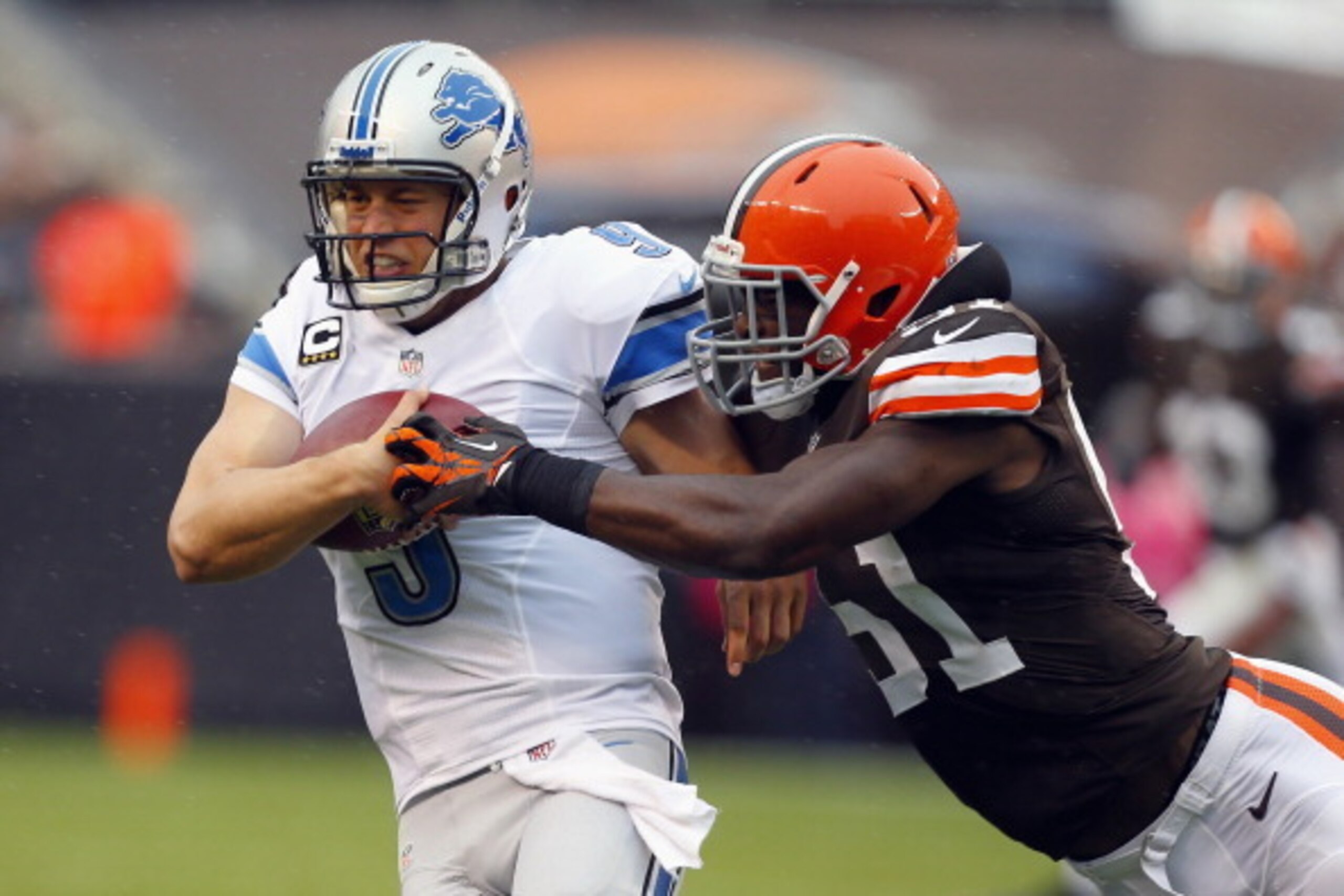 CLEVELAND, OH - OCTOBER 13:  Quarterback Matthew Stafford #9 of the Detroit Lions is hit by linebacker Barkevious Mingo #51 of the Cleveland Browns at FirstEnergy Stadium on October 13, 2013 in Cleveland, Ohio.  (Photo by Matt Sullivan/Getty Images)