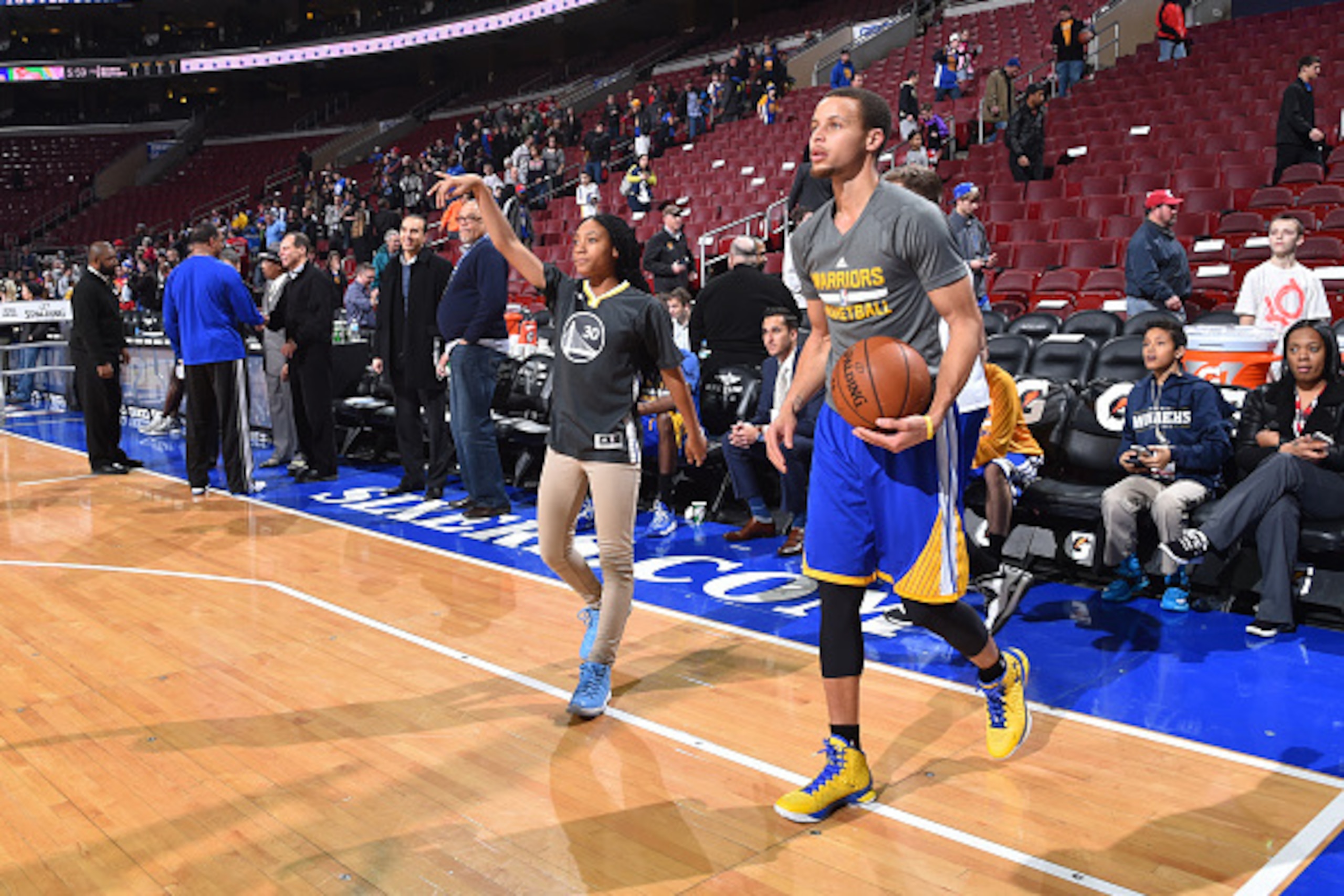 PHILADELPHIA, PA - FEBRUARY 9:  Stephen Curry #30 of the Golden State Warriors shoots around with Mo'ne Davis Little League star prior to the game against the Philadelphia 76ers at Wells Fargo Center on February 9, 2015 in Philadelphia, Pennsylvania NOTE 