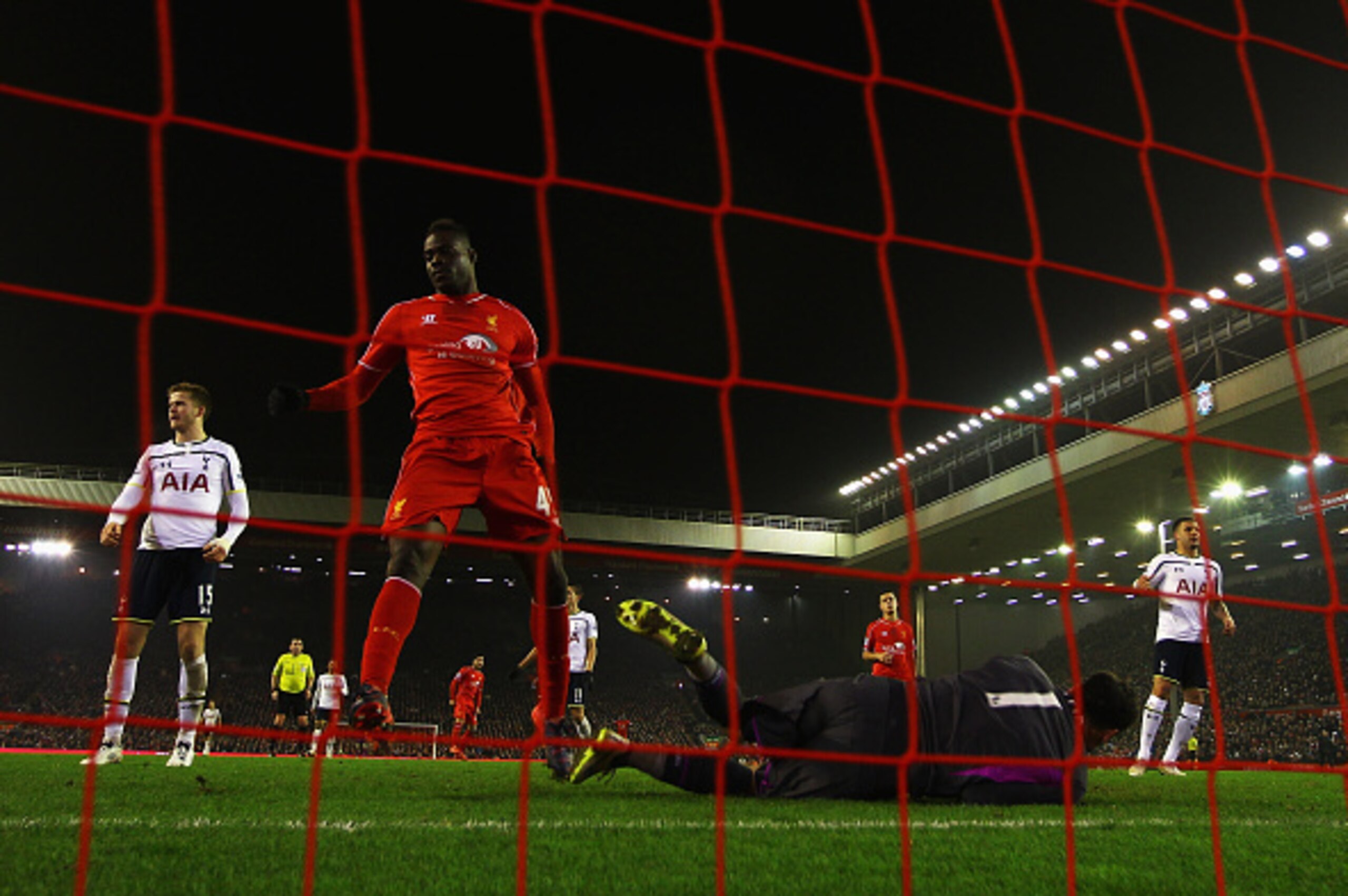 LIVERPOOL, ENGLAND - FEBRUARY 10:  Mario Balotelli of Liverpool scores the winning goal past Hugo Lloris of Tottenham Hotspur during the Barclays Premier League match between Liverpool and Tottenham Hotspur at Anfield on February 10, 2015 in Liverpool, En