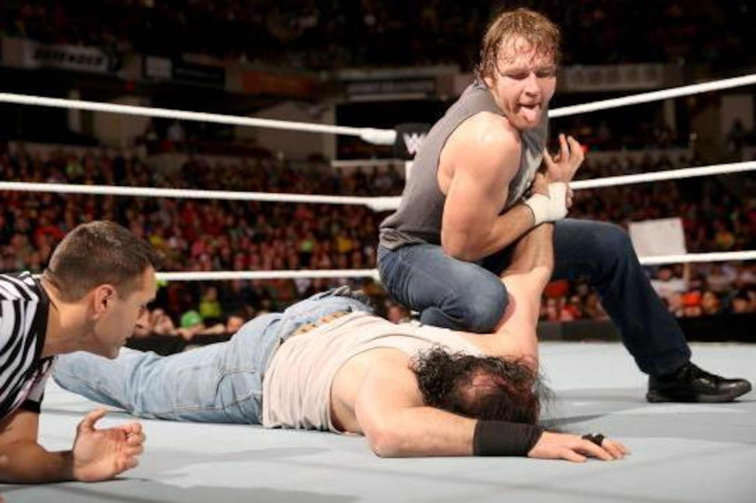 Dean Ambrose in control of Luke Harper.