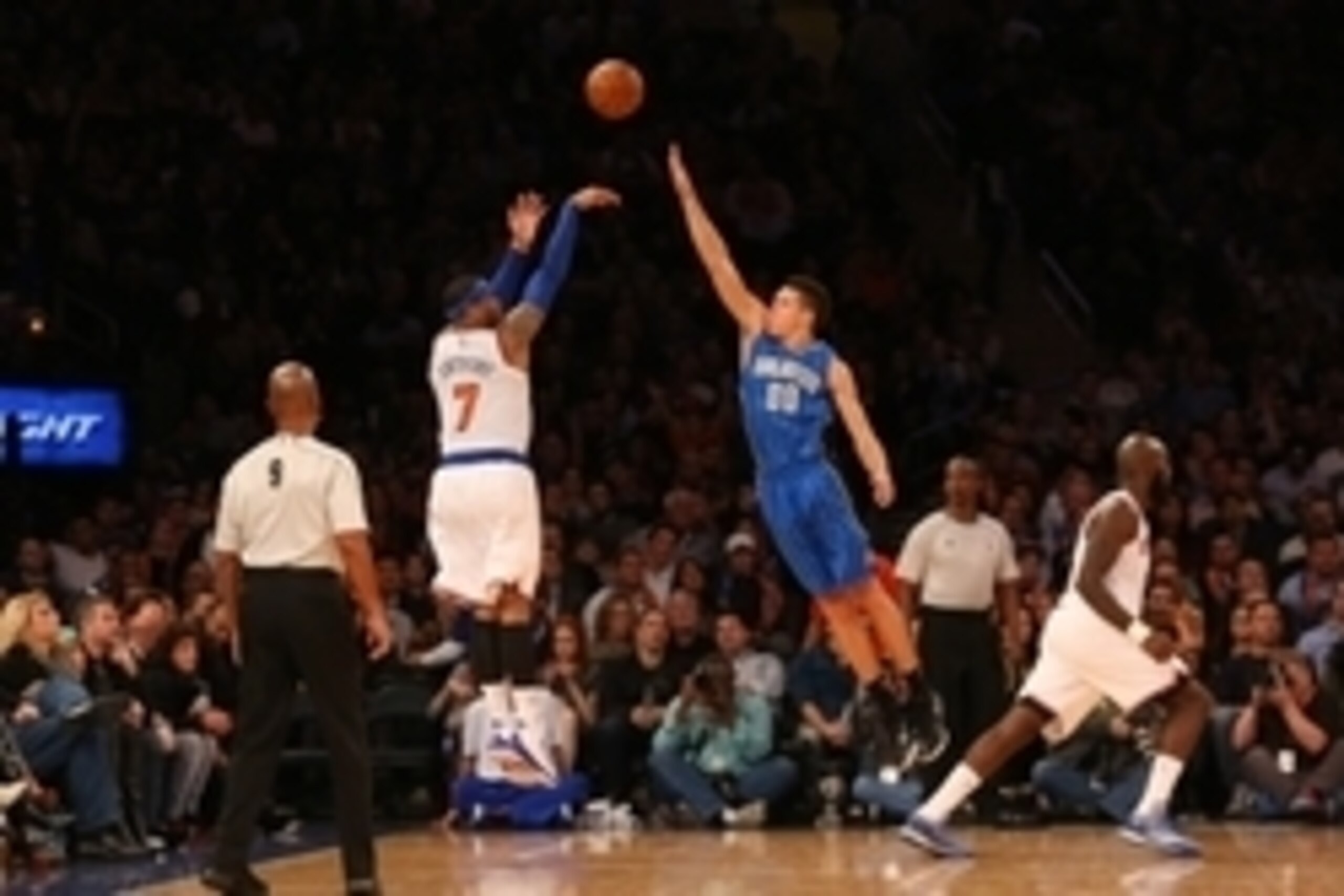 Jan 23, 2015; New York, NY, USA;  New York Knicks forward Carmelo Anthony (7) shoots for three over Orlando Magic forward Aaron Gordon (00) during the fourth quarter at Madison Square Garden. Knicks won 113-106. Mandatory Credit: Anthony Gruppuso-USA TODA