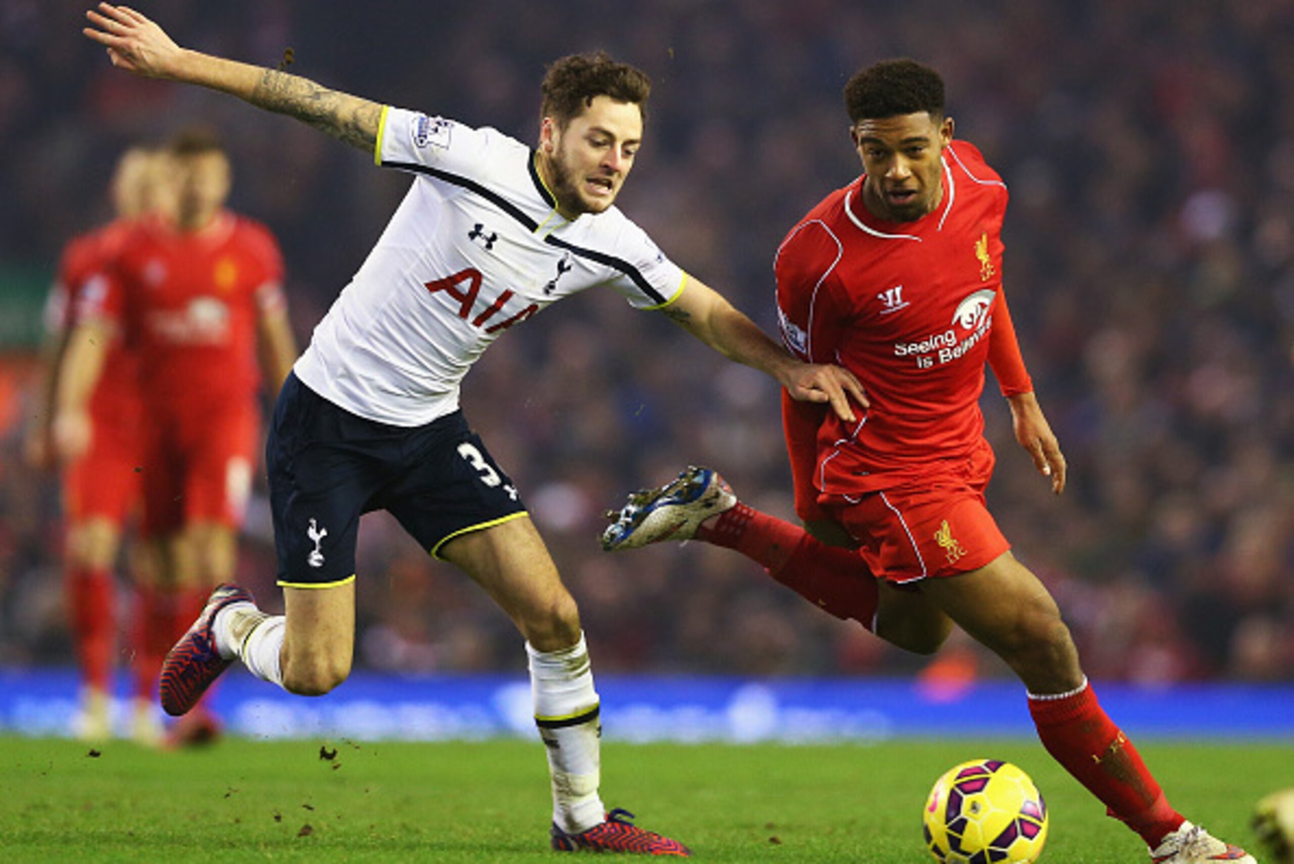 LIVERPOOL, ENGLAND - FEBRUARY 10: Jordon Ibe of Liverpool takes on Ryan Mason of Tottenham Hotspur during the Barclays Premier League match between Liverpool and Tottenham Hotspur at Anfield on February 10, 2015 in Liverpool, England.  (Photo by Clive Bru