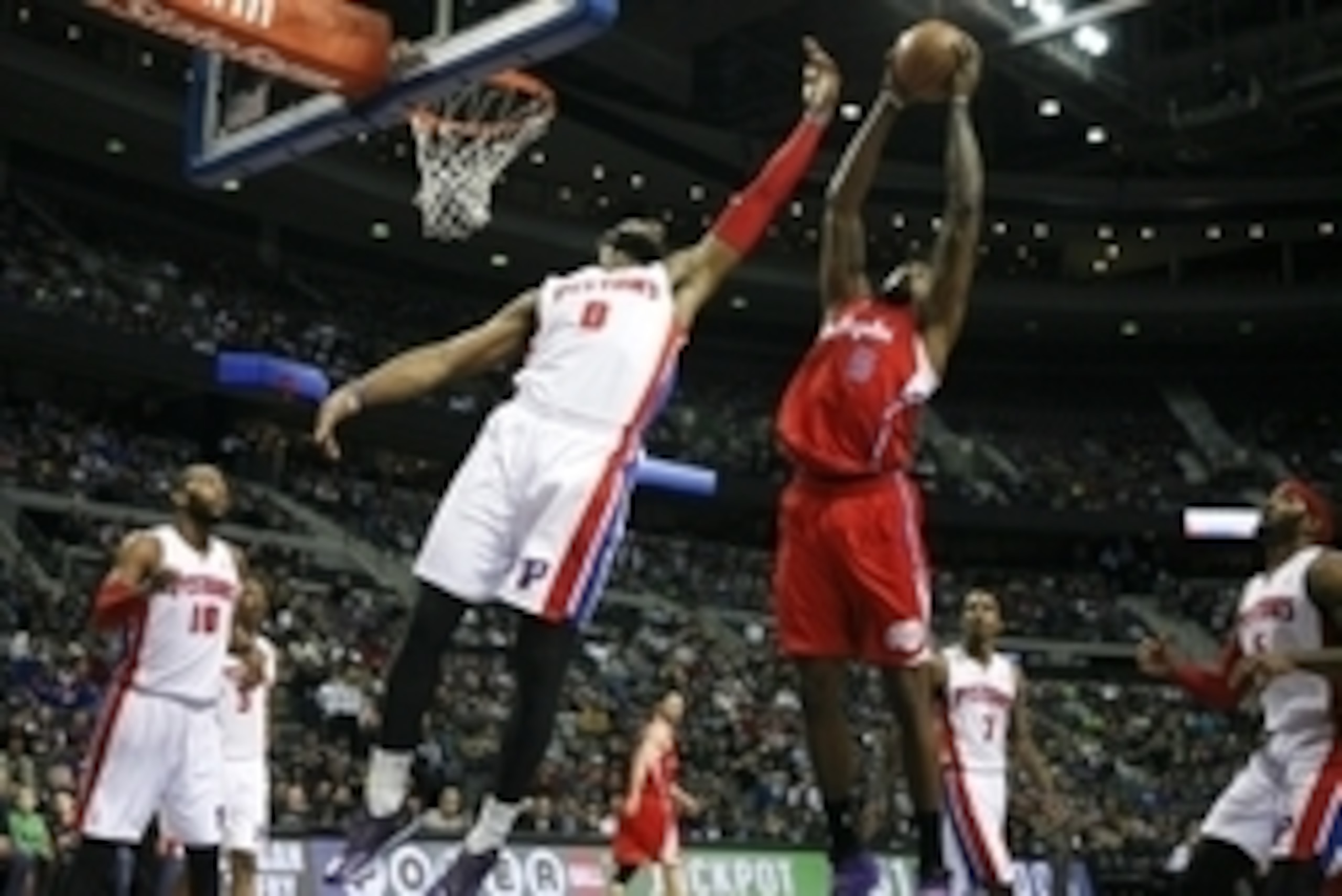 Jan 20, 2014; Auburn Hills, MI, USA; Los Angeles Clippers center DeAndre Jordan (6) gets a rebound over Detroit Pistons center Andre Drummond (0) during the first quarter at The Palace of Auburn Hills. Clippers beat the Pistons 112-103. Mandatory Credit: 