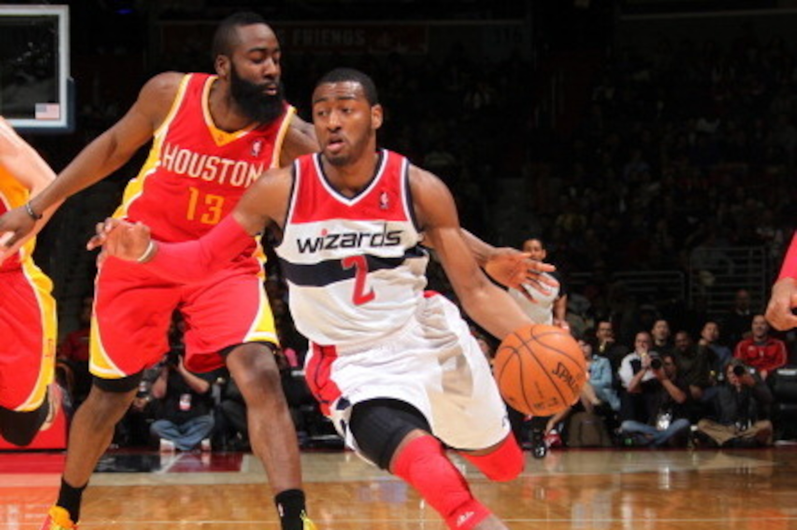 WASHINGTON, DC - FEBRUARY 23: John Wall #2 of the Washington Wizards drives against James Harden #13 of the Houston Rockets during the game at the Verizon Center on February 23, 2013 in Washington, DC. NOTE TO USER: User expressly acknowledges and agrees 