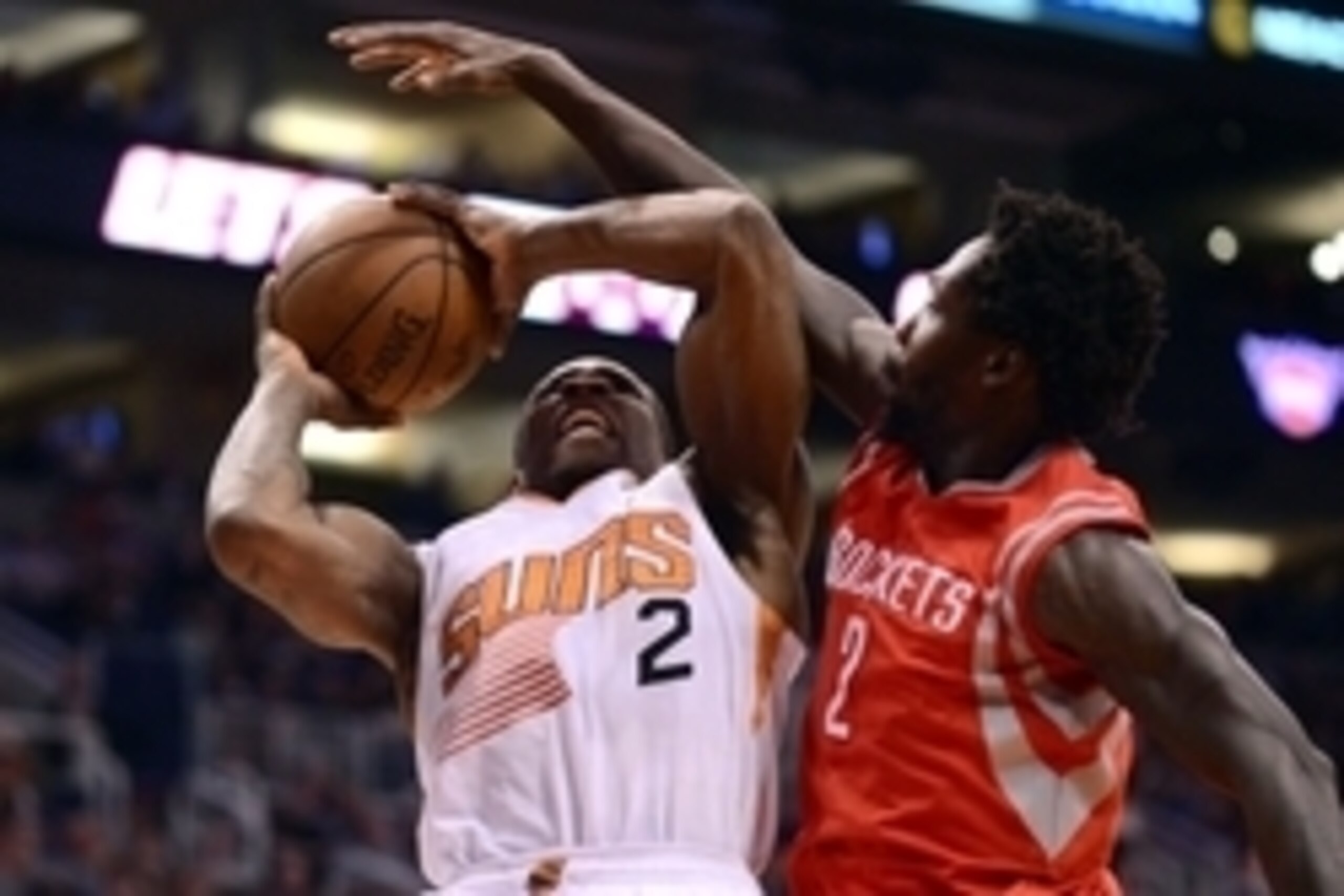 Feb 10, 2015; Phoenix, AZ, USA; Phoenix Suns guard Eric Bledsoe (2) attempts to shoot the ball as Houston Rockets guard Patrick Beverley (2) defends at US Airways Center. Mandatory Credit: Joe Camporeale-USA TODAY Sports