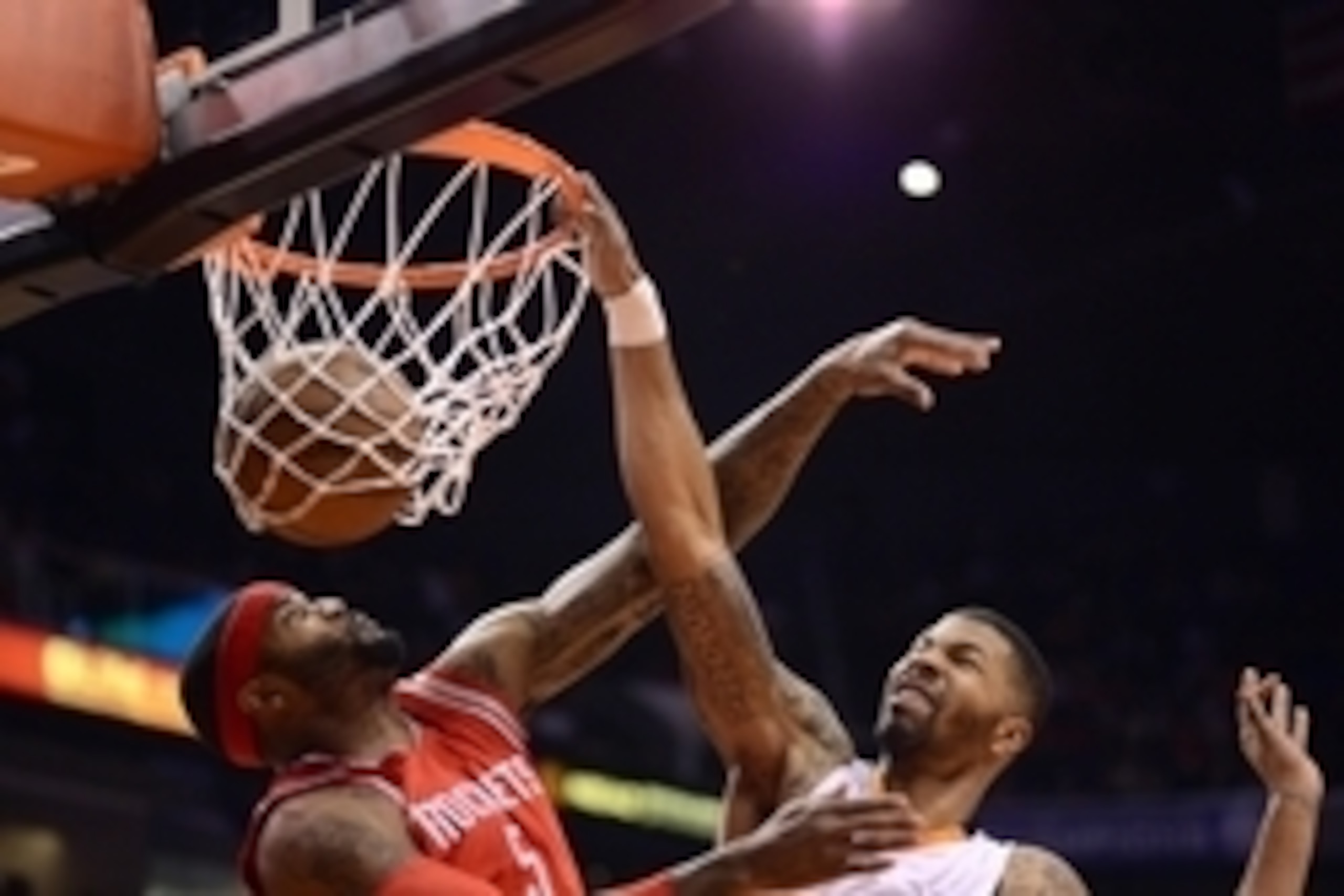 Feb 10, 2015; Phoenix, AZ, USA; Phoenix Suns forward Markieff Morris (11) dunks the ball over Houston Rockets forward Josh Smith (5) at US Airways Center. Mandatory Credit: Joe Camporeale-USA TODAY Sports