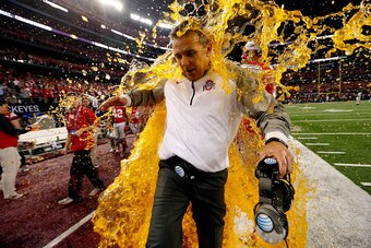 ARLINGTON, TX - JANUARY 12:  Head Coach Urban Meyer of the Ohio State Buckeyes gets dunked with Gatorade by tight end Nick Vannett #81 in the fourth quarter against the Oregon Ducks during the College Football Playoff National Championship Game at AT&T St