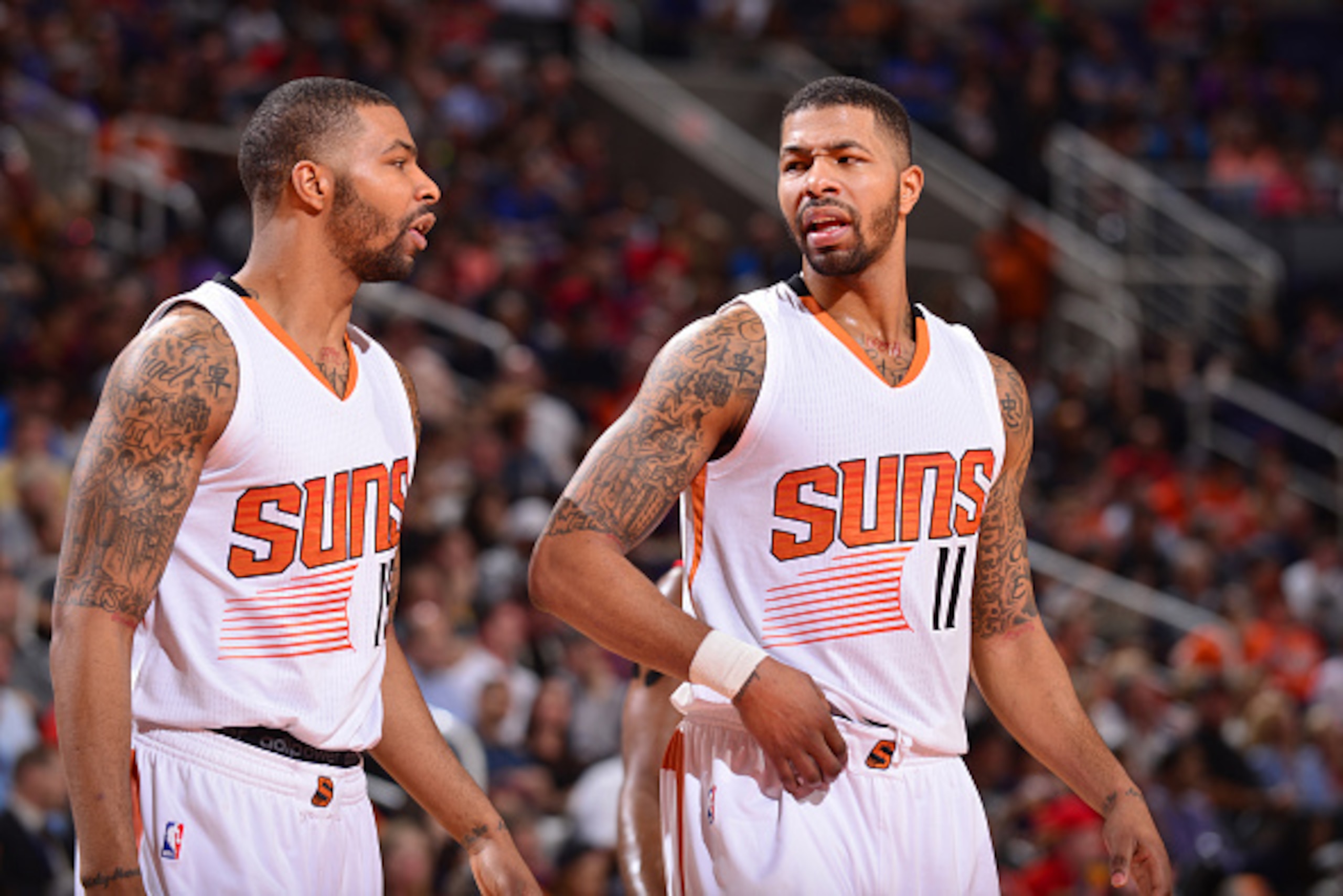 PHOENIX, AZ -  FEBRUARY 10: Marcus Morris #15 and Markieff Morris #11 of the Phoenix Suns during the game against the Houston Rockets on February 10, 2015 at US Airways Center in Phoenix, Arizona. NOTE TO USER: User expressly acknowledges and agrees that,