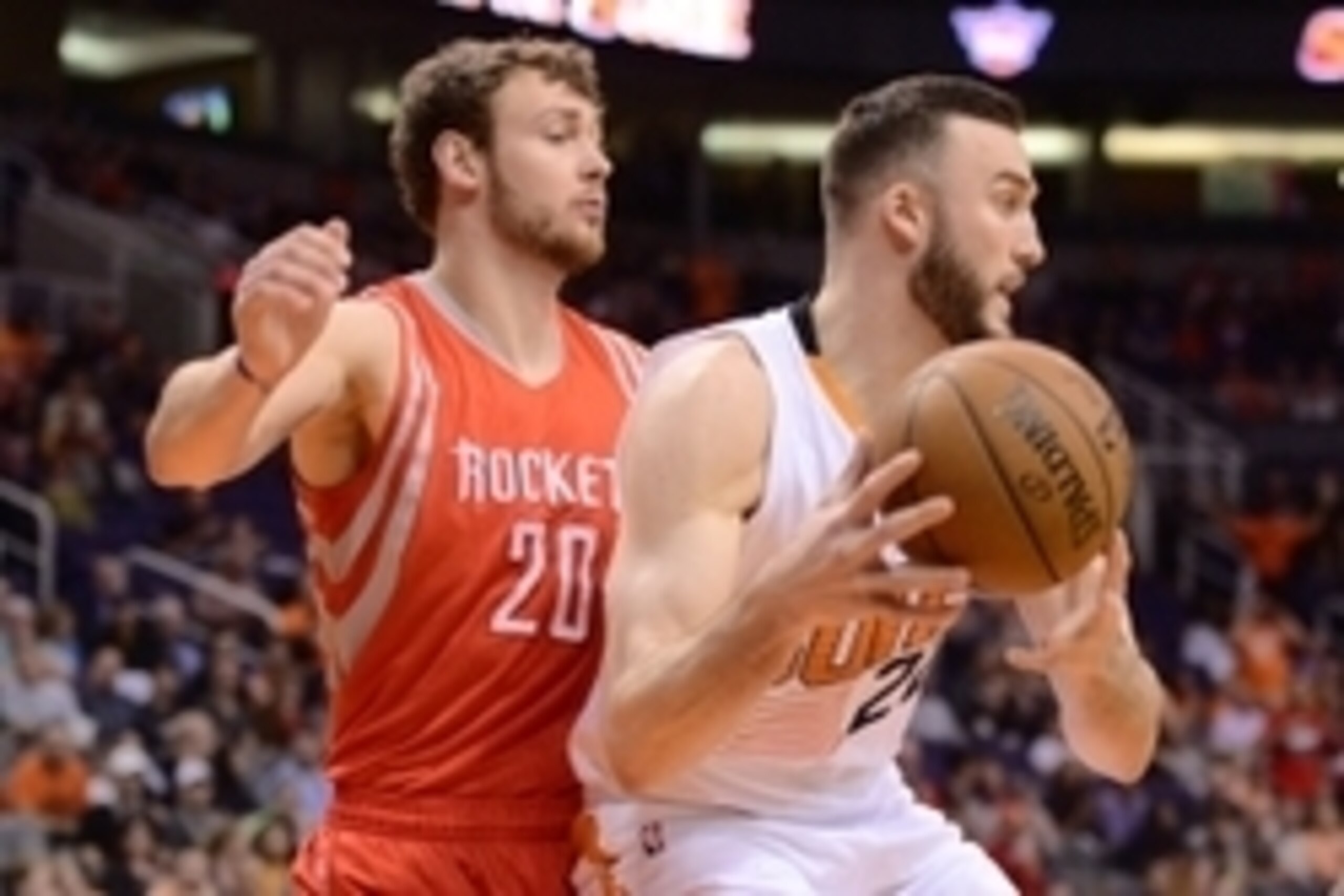 Feb 10, 2015; Phoenix, AZ, USA; Houston Rockets forward Donatas Motiejunas (20) guards Phoenix Suns center Miles Plumlee (22) at US Airways Center. Mandatory Credit: Joe Camporeale-USA TODAY Sports