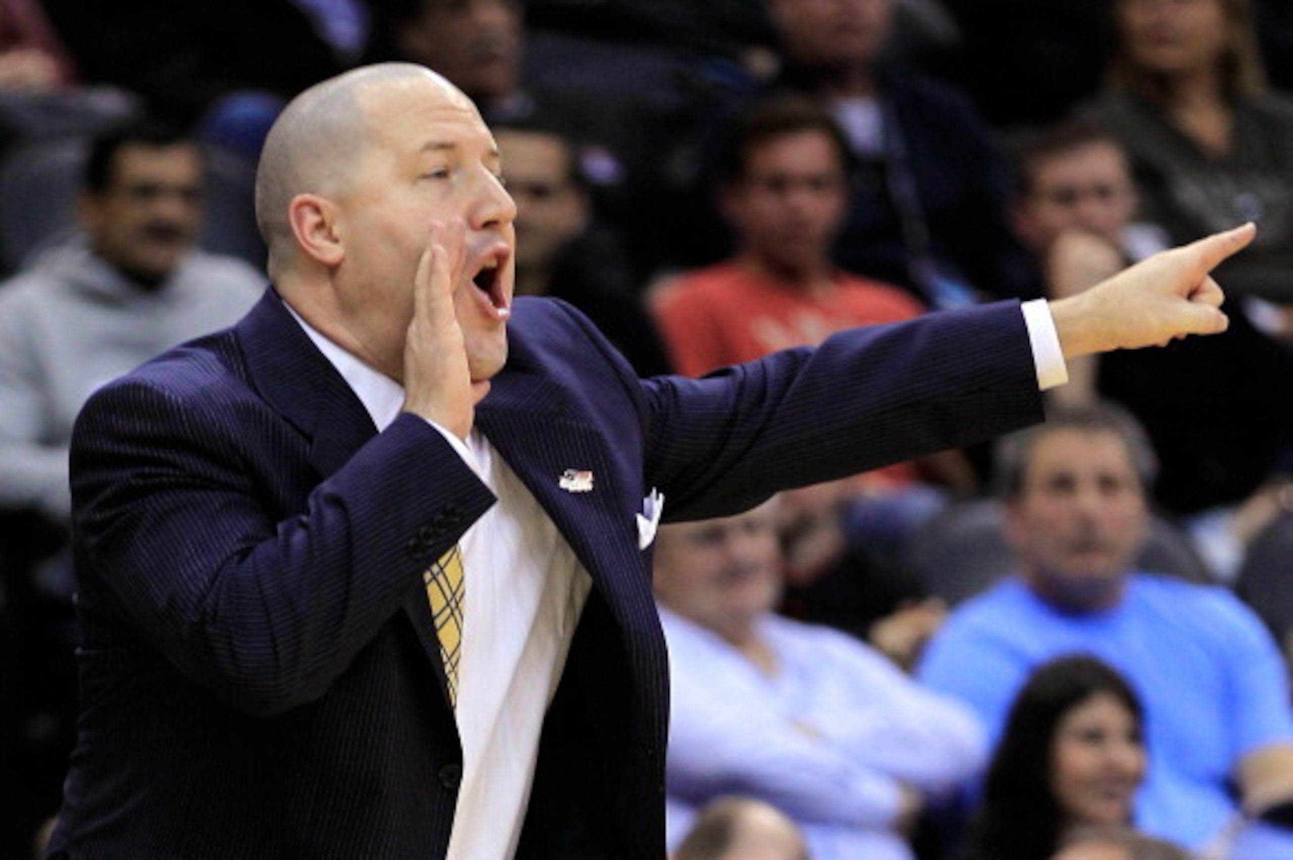 NEWARK, NJ - MARCH 25:  Head coach Buzz Williams of the Marquette Golden Eagles reacts after a play against the North Carolina Tar Heels during the first half the east regional semifinal of the 2011 NCAA Men's Basketball Tournament at the Prudential Cente