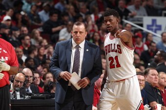 CHICAGO, IL - APRIL 11: Jimmy Butler #21 of the Chicago Bulls confers with Head Coach Tom Thibodeau during a break in action against New York Knicks on April 11, 2013 at the United Center in Chicago, Illinois. NOTE TO USER: User expressly acknowledges and