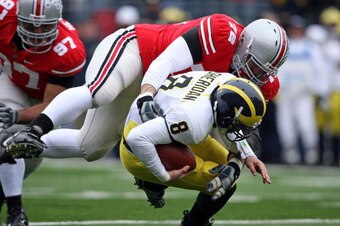 COLUMBUS, OH - NOVEMBER 22:  Dexter Larimore #72 of the Ohio State Buckeyes sacks Nick Sheridan #8 of the Michigan Wolverines during the Big Ten Conference game at Ohio Stadium on November 22, 2008 in Columbus, Ohio.  (Photo by Andy Lyons/Getty Images)