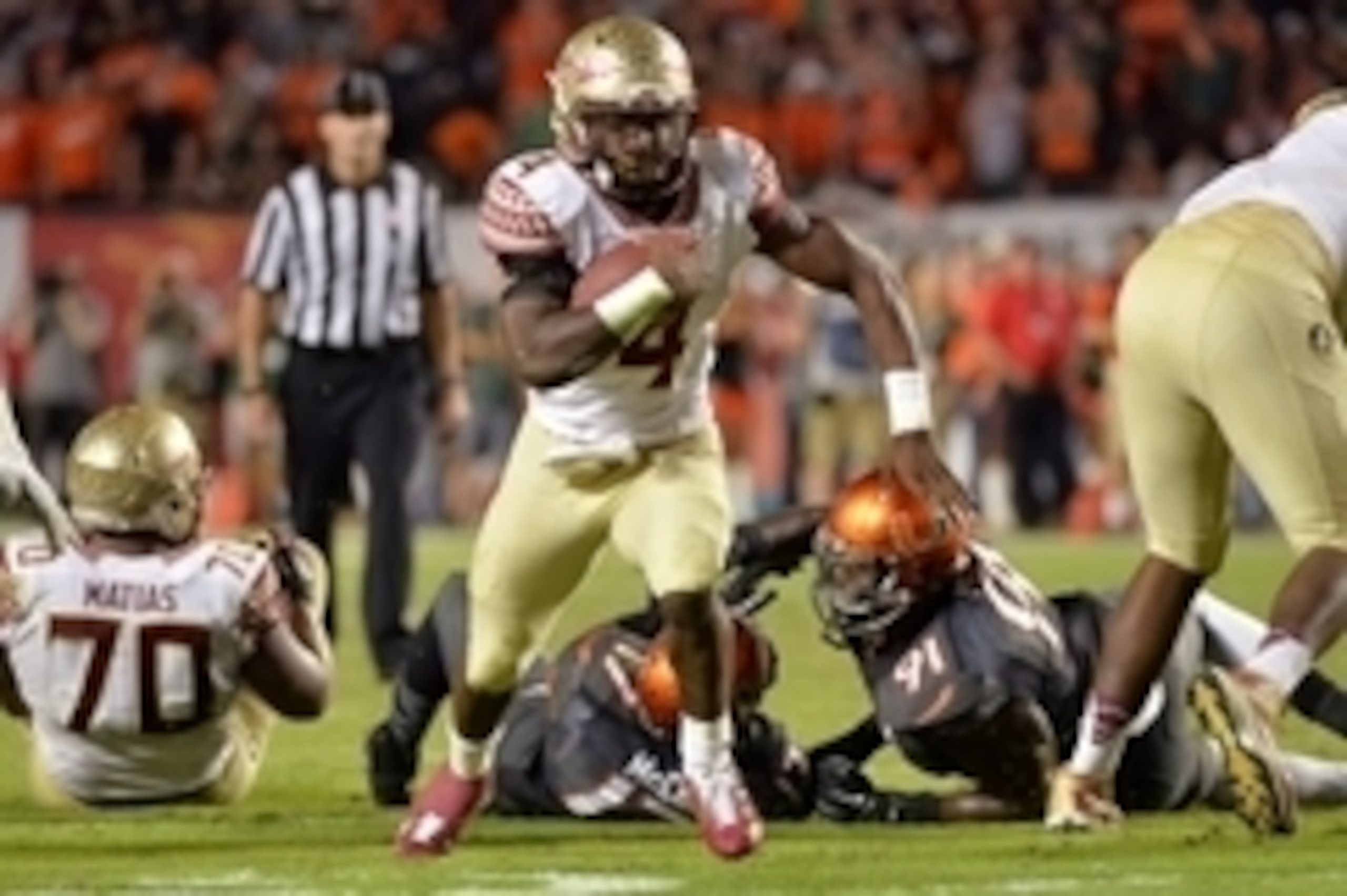 Nov 15, 2014; Miami Gardens, FL, USA; Florida State Seminoles running back Dalvin Cook (4) runs for a touchdown against the Miami Hurricanes during the second half at Sun Life Stadium.  FSU won 30-26. Mandatory Credit: Steve Mitchell-USA TODAY Sports