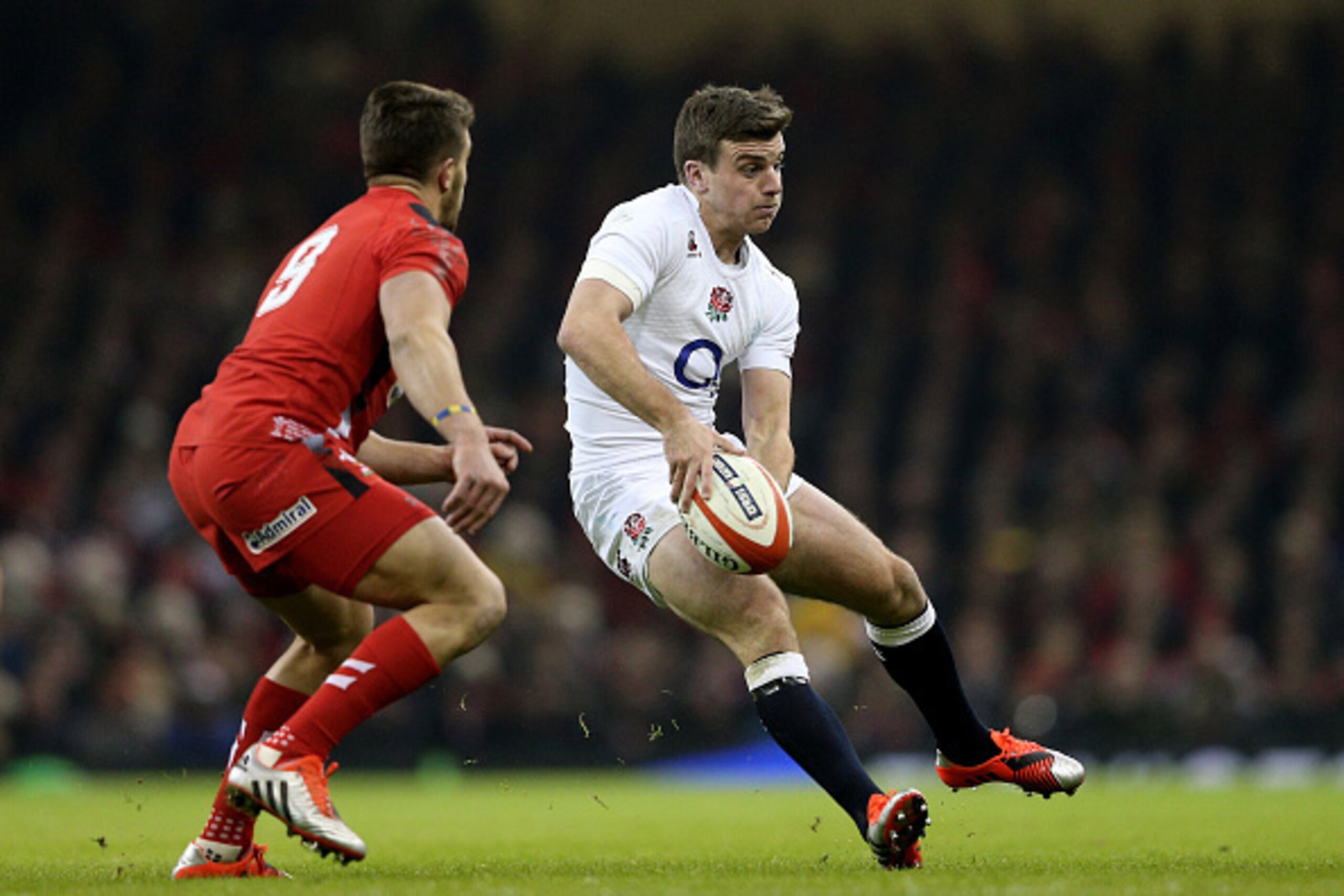 CARDIFF, WALES - FEBRUARY 06:  George Ford of England passes as Rhys Webb of Wales closes in during the RBS Six Nations match between Wales and England at the Millennium Stadium on February 6, 2015 in Cardiff, Wales.  (Photo by Clive Mason/Getty Images)