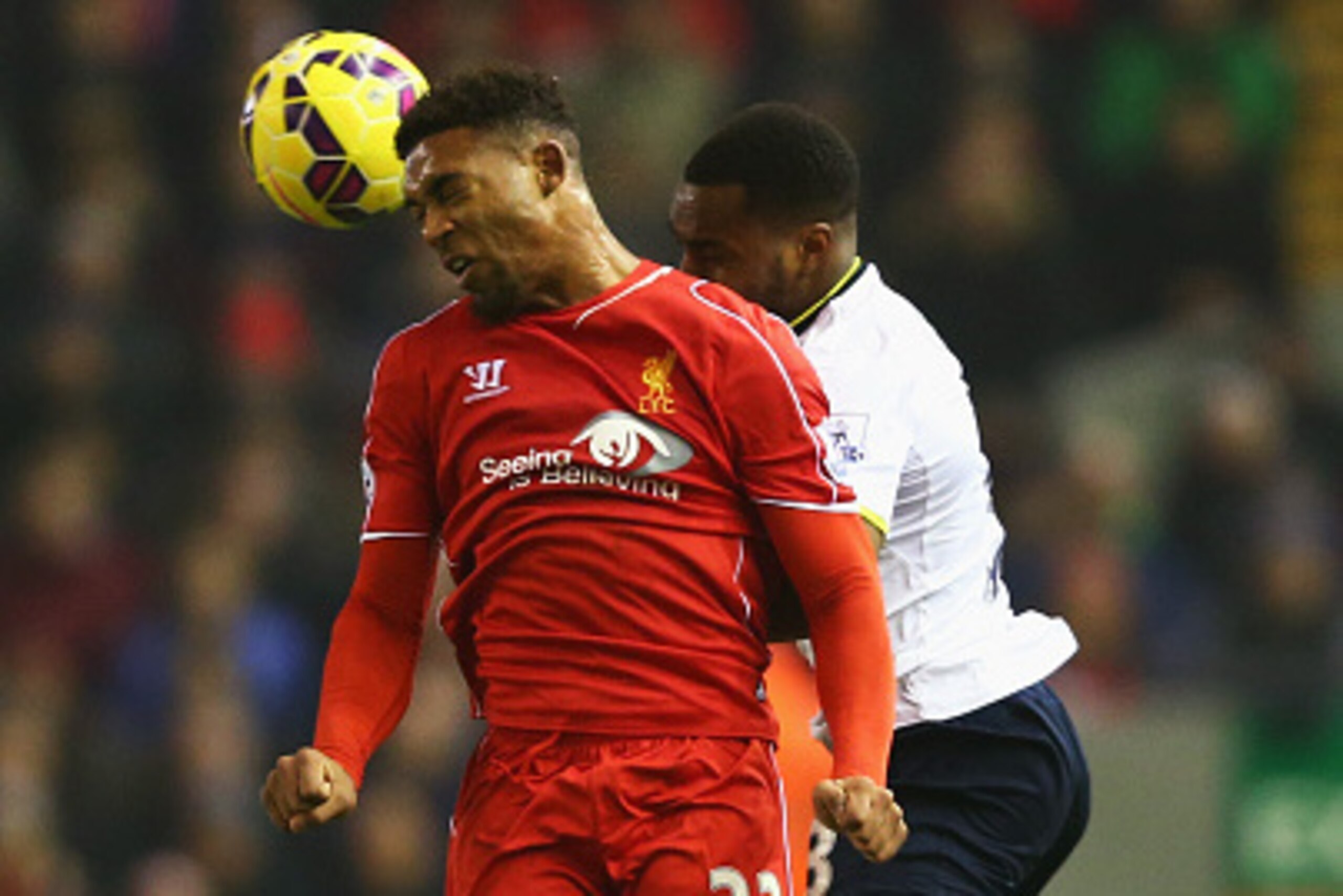 LIVERPOOL, ENGLAND - FEBRUARY 10: Jordon Ibe of Liverpool wins a header with Danny Rose of Tottenham Hotspur during the Barclays Premier League match between Liverpool and Tottenham Hotspur at Anfield on February 10, 2015 in Liverpool, England.  (Photo by