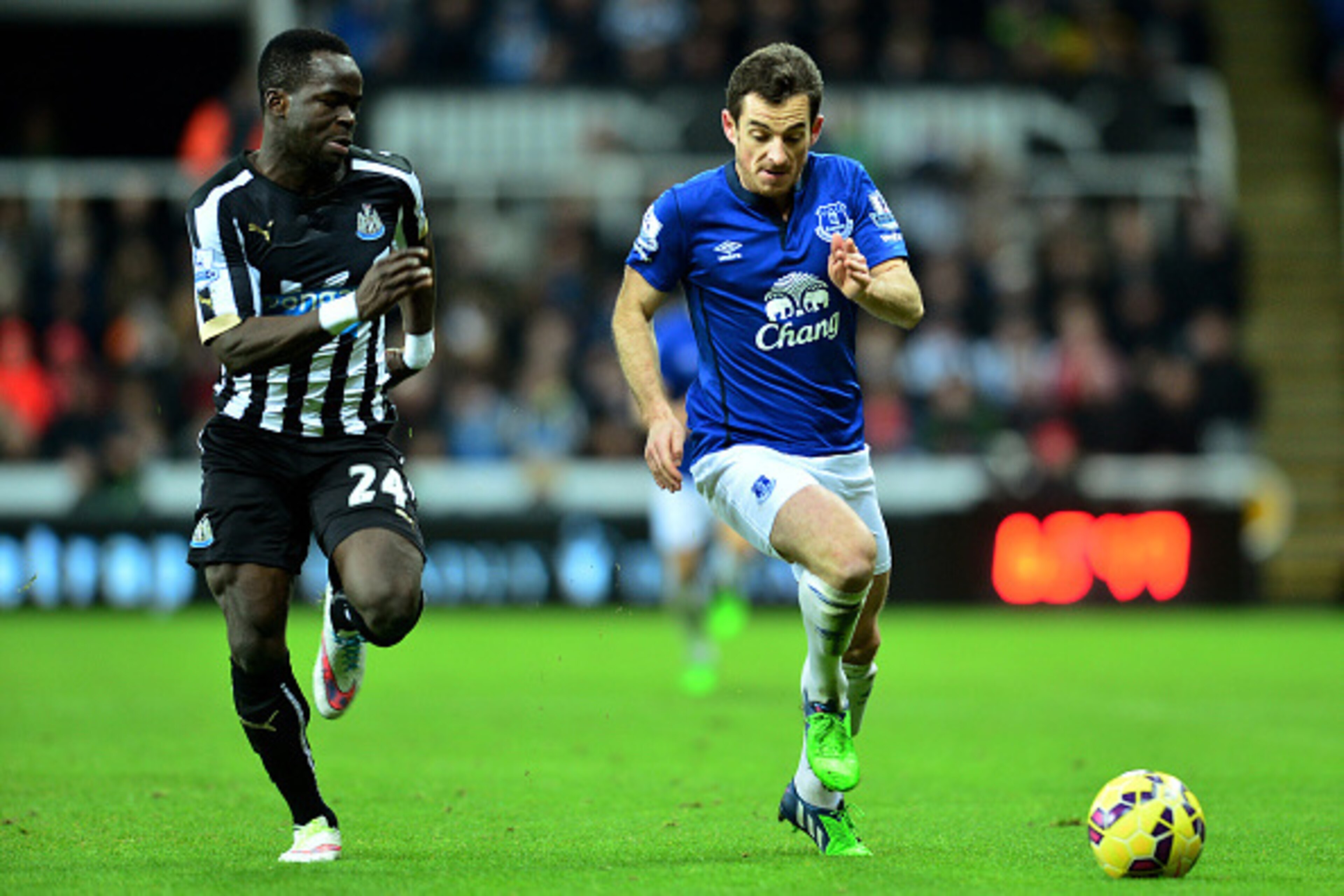 NEWCASTLE UPON TYNE, ENGLAND - DECEMBER 28:  Leighton Baines of Everton is pursued by Cheik Ismael Tiote of Newcastle United during the Barclays Premier League match between Newcastle United and Everton at St James' Park on December 28, 2014 in Newcastle 