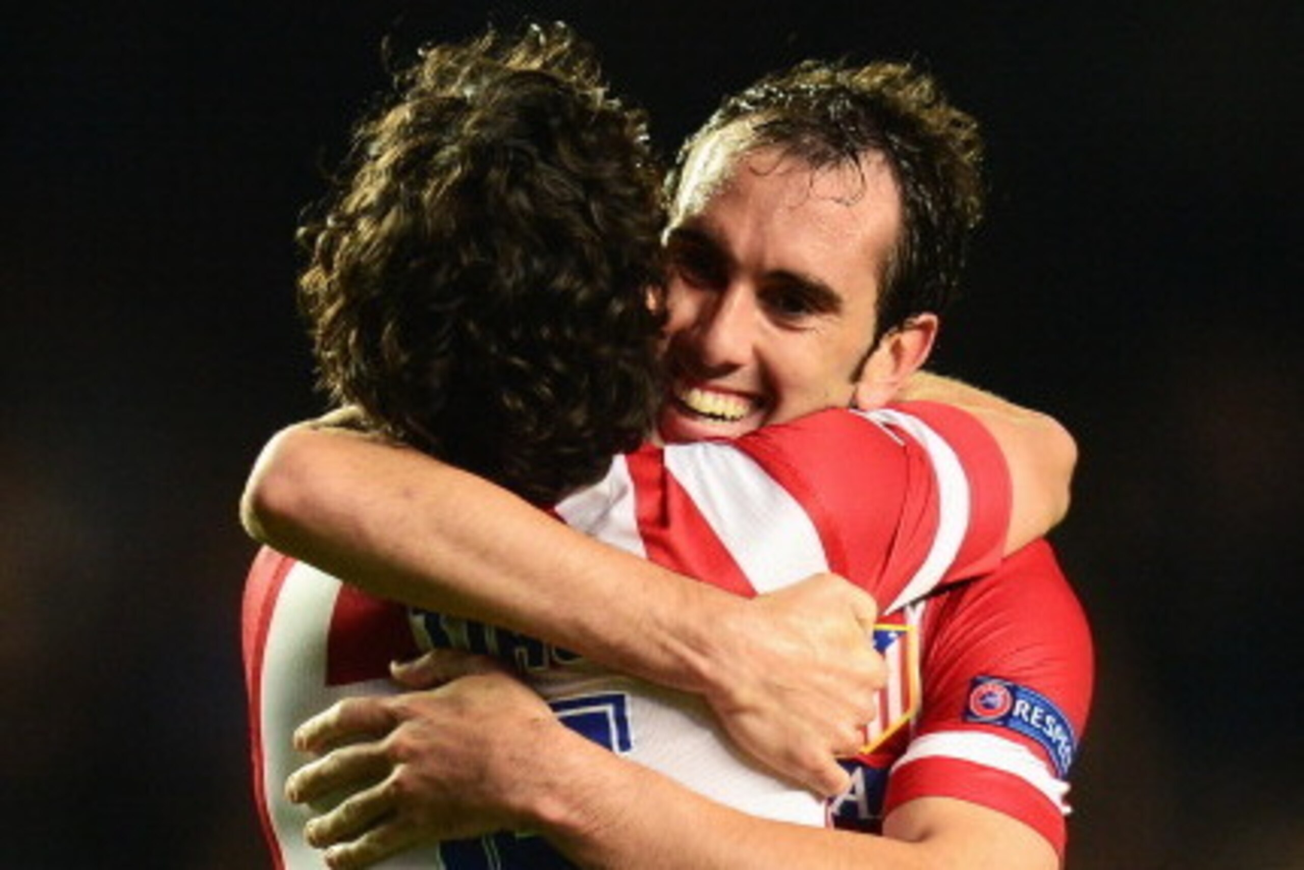 LONDON, ENGLAND - APRIL 30: Diego Godin of Club Atletico de Madrid celebrates victory with Tiago of Club Atletico de Madrid during the UEFA Champions League semi-final second leg match between Chelsea and Club Atletico de Madrid at Stamford Bridge on Apri