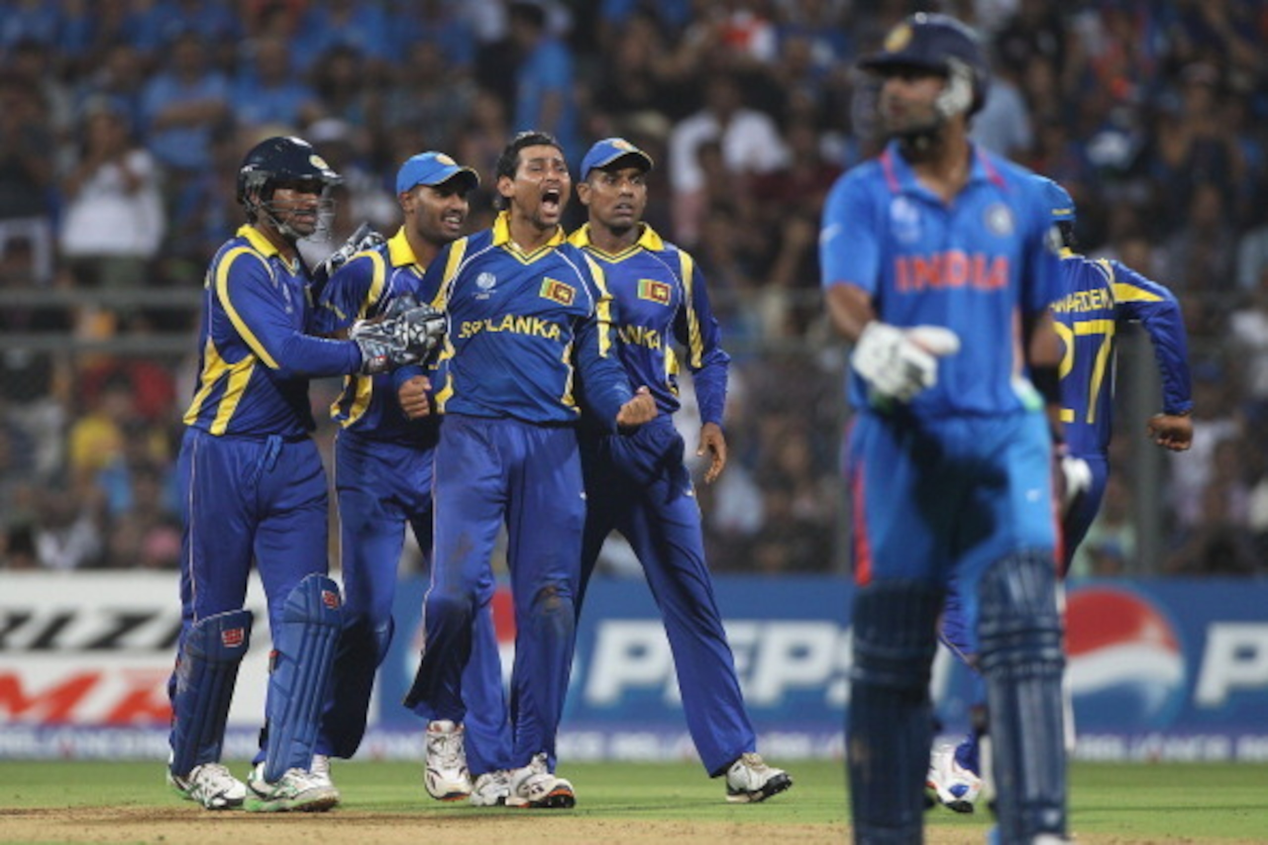 MUMBAI, INDIA - APRIL 02: Tillakaratne Dilshan (3L) of Sri Lanka celebrates taking the wicket of Virat Kohli (R) during the 2011 ICC World Cup Final between India and Sri Lanka at Wankhede Stadium on April 2, 2011 in Mumbai, India. (Photo by Michael Ste MUMBAI, INDIA - APRIL 02: Tillakaratne Dilshan (3L) of Sri Lanka celebrates taking the wicket of Virat Kohli (R) during the 2011 ICC World Cup Final between India and Sri Lanka at Wankhede Stadium on April 2, 2011 in Mumbai, India. (Photo by Michael Ste