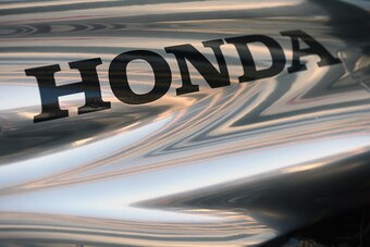 TOKYO, JAPAN - FEBRUARY 10: Honda logo is seen on McLaren Honda MP4-29H/1X1 is displayed in front of the Honda Motor Co. headquarters on February 10, 2015 in Tokyo, Japan. Honda Motor Co., Ltd. will hold a press conference in the run-up to the Australian 