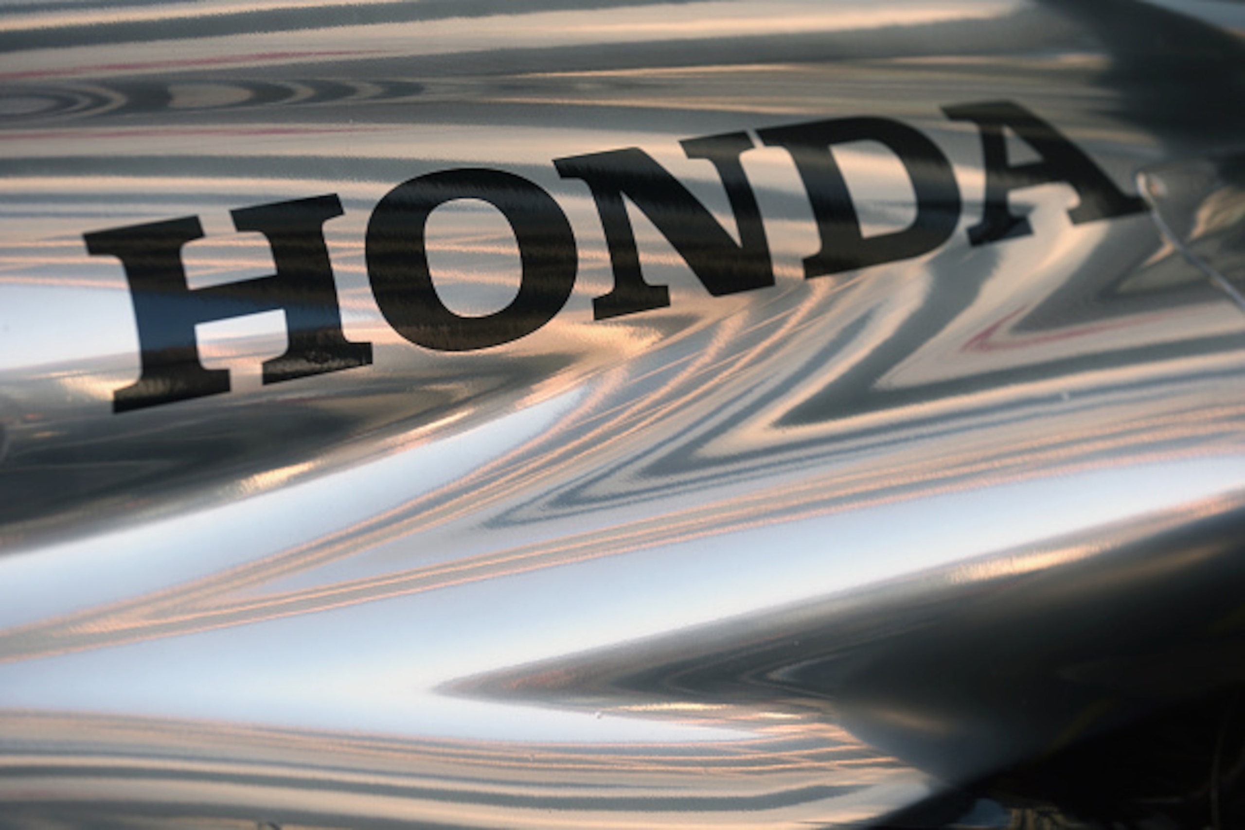 TOKYO, JAPAN - FEBRUARY 10: Honda logo is seen on McLaren Honda MP4-29H/1X1 is displayed in front of the Honda Motor Co. headquarters on February 10, 2015 in Tokyo, Japan. Honda Motor Co., Ltd. will hold a press conference in the run-up to the Australian 