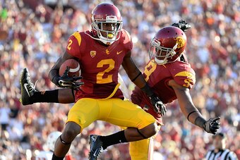 LOS ANGELES, CA - AUGUST 30:  Adoree' Jackson #2 of the USC Trojans celebrates his touchdwon with JuJu Smith #9 to take a 31-7 lead over the Fresno State Bulldogs during the second quarter at Los Angeles Memorial Coliseum on August 30, 2014 in Los Angeles