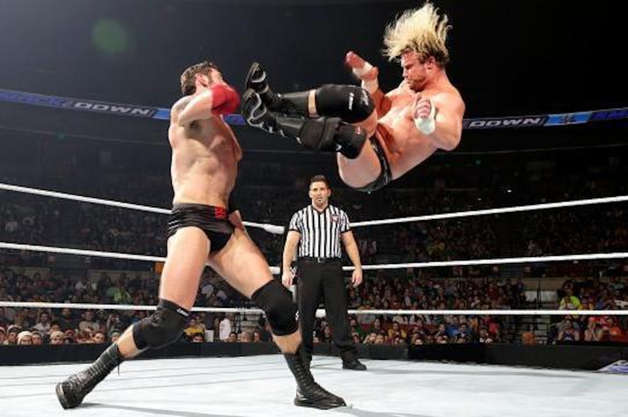 Dolph Ziggler dropkicks Bad News Barrett.