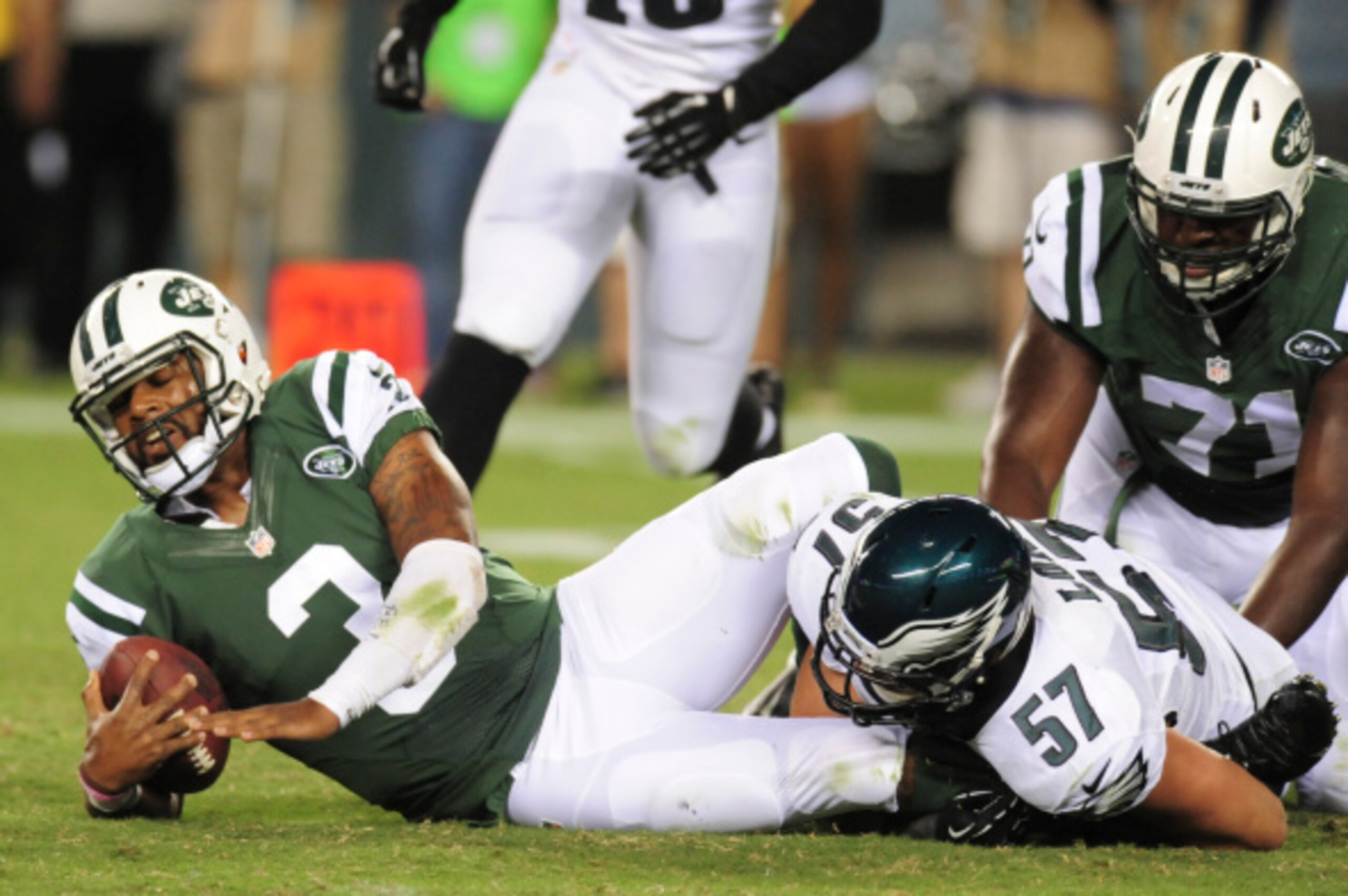 PHILADELPHIA, PA - AUGUST 28: Quarterback Tajh Boyd #3 of the New York Jets is sacked by linebacker Travis Long #57 of the Philadelphia Eagles in the preseason game on August 28, 2014 at Lincoln Financial Field in Philadelphia, Pennsylvania. (Photo by Eva