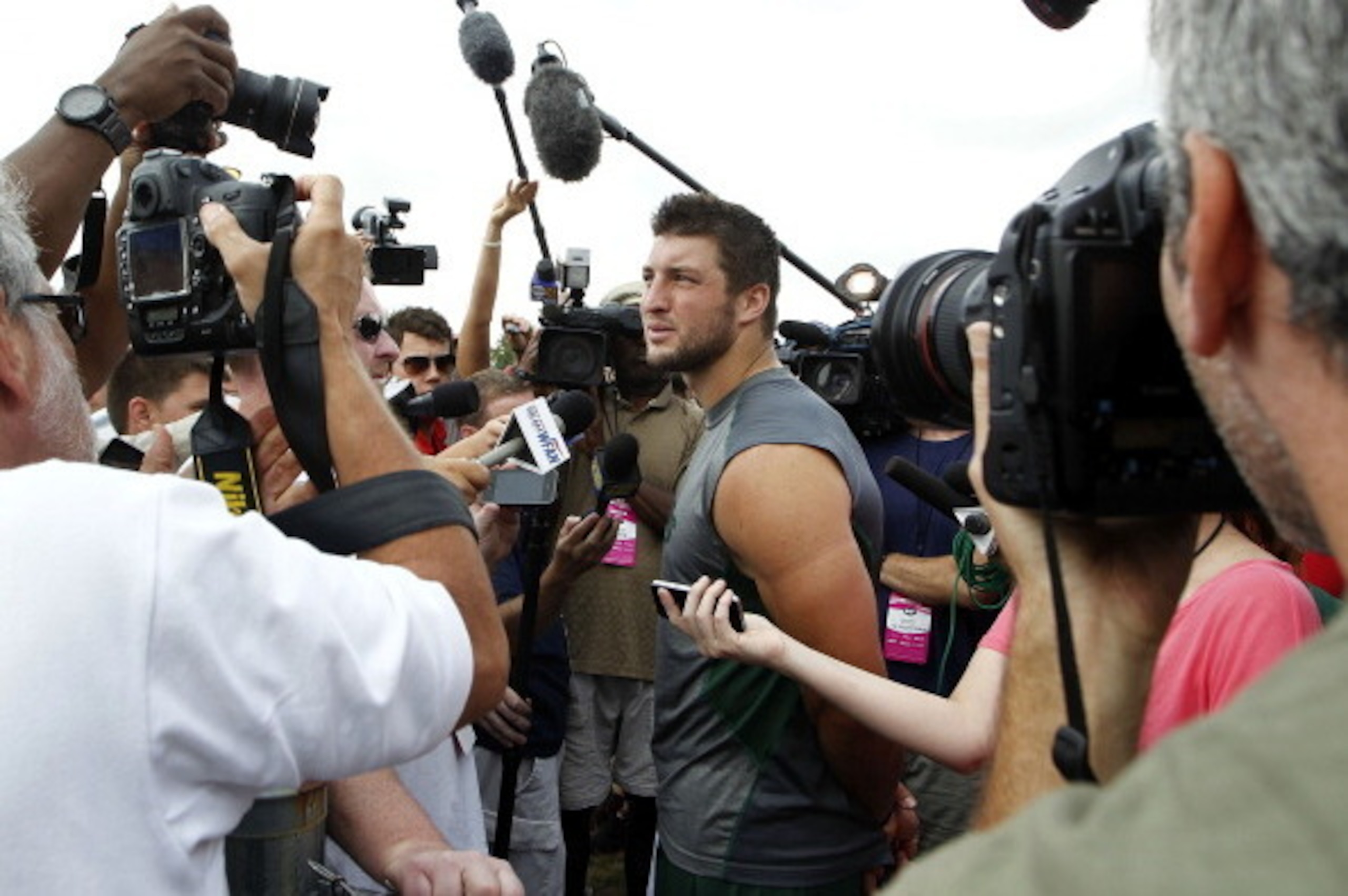 CORTLAND, NY - JULY 27:  Tim Tebow #15 of the New York Jets talks to reporters at Jets Training Camp at SUNY Cortland on July 27, 2012 in Cortland, New York.  (Photo by Jeff Zelevansky/Getty Images)