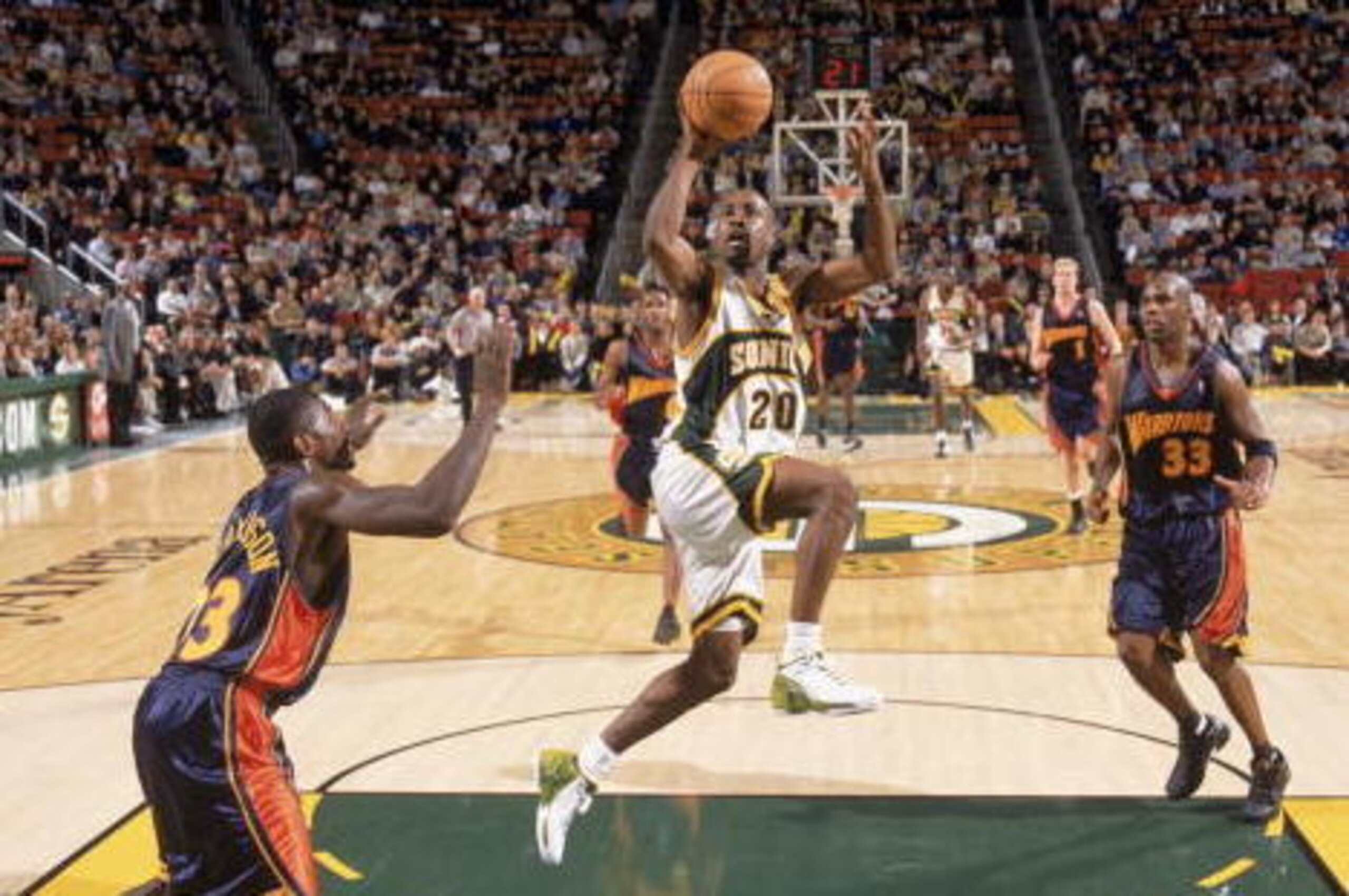 SEATTLE - JANUARY 28:  Gary Payton #20 of the Seattle Sonics takes takes the ball to the hoop during the game against the Golden State Warriors at Key Arena on January 28, 2003 in Seattle, Washington. The Sonics defeated the Warriors 91-88.  NOTE TO USER: