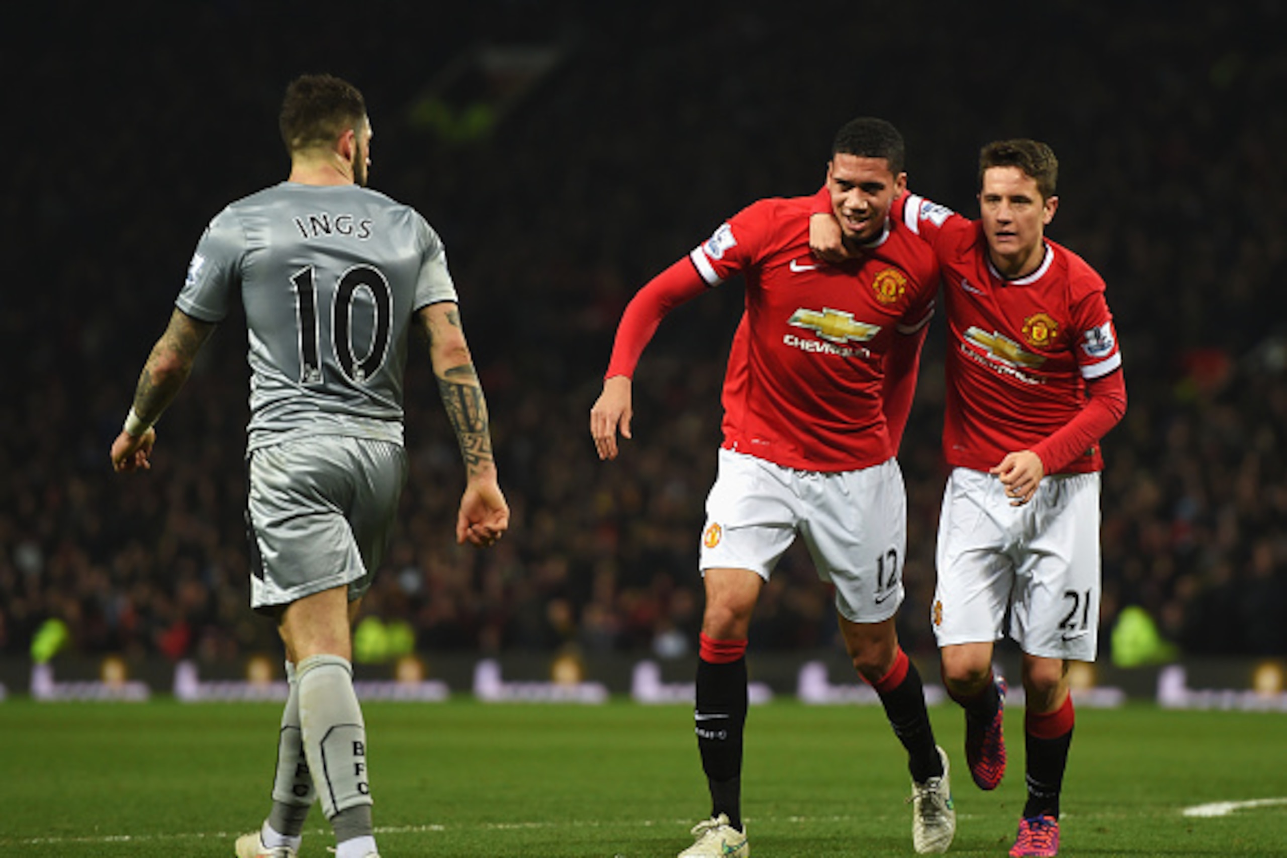 MANCHESTER, ENGLAND - FEBRUARY 11:  Chris Smalling of Manchester United celebrates scoring his second goal with Ander Herrera of Manchester United during the Barclays Premier League match between Manchester United and Burnley at Old Trafford on February 1