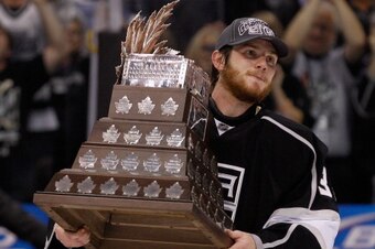 LOS ANGELES, CA - JUNE 11:  Jonathan Quick #32 of the Los Angeles Kings holds the Conn Smythe Trophy after the Kings defeated the New Jersey Devils 6-1 to win the Stanley Cup series 4-2 in Game Six of the 2012 Stanley Cup Final at Staples Center on June 1