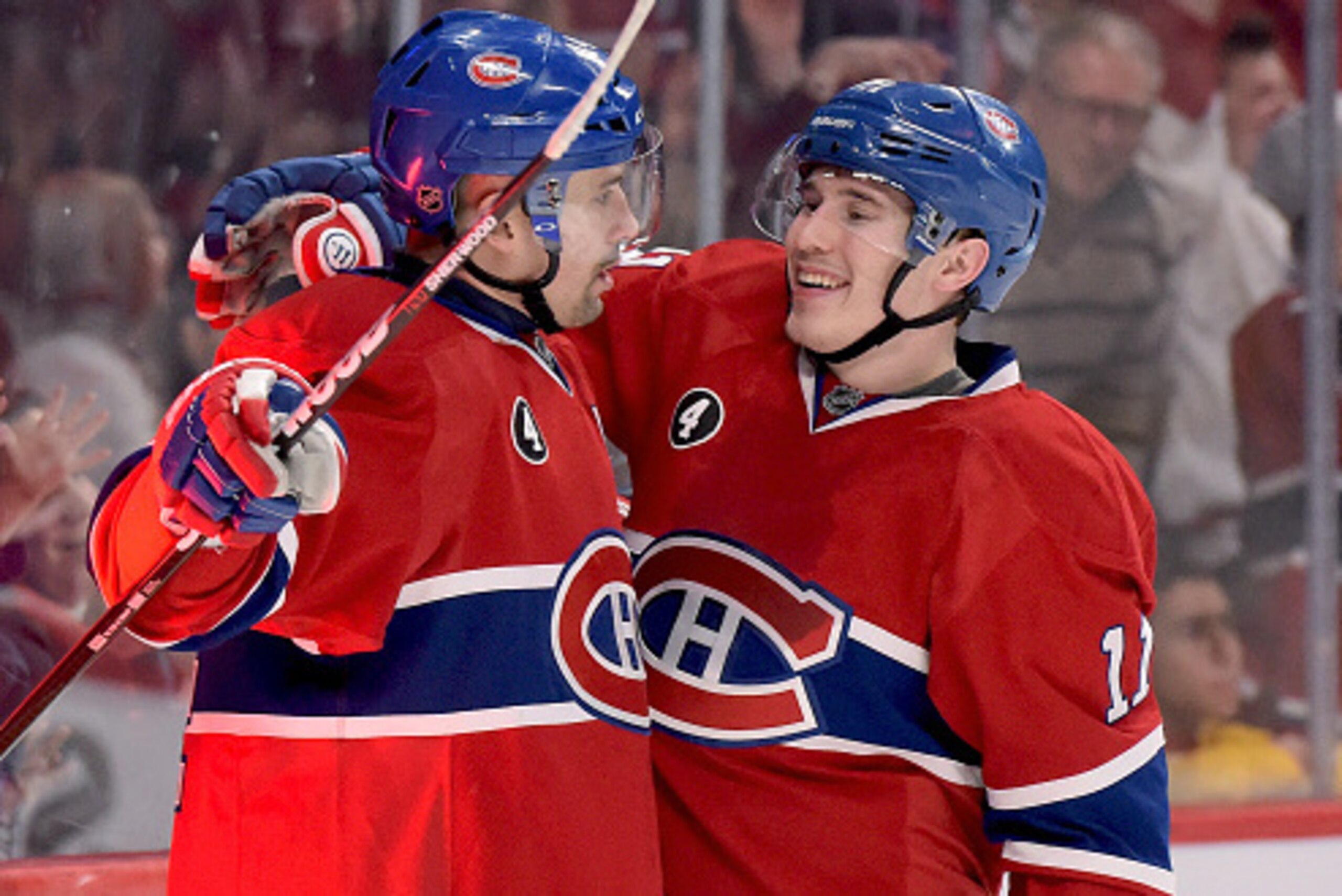 MONTREAL, QC - FEBRUARY 7: Tomas Plekanec #14 of the Montreal Canadiens celebrates with teammate Brendan Gallagher #11 after scoring a goal against the New Jersey Devils in the NHL game at the Bell Centre on February 7, 2015 in Montreal, Quebec, Canada. (