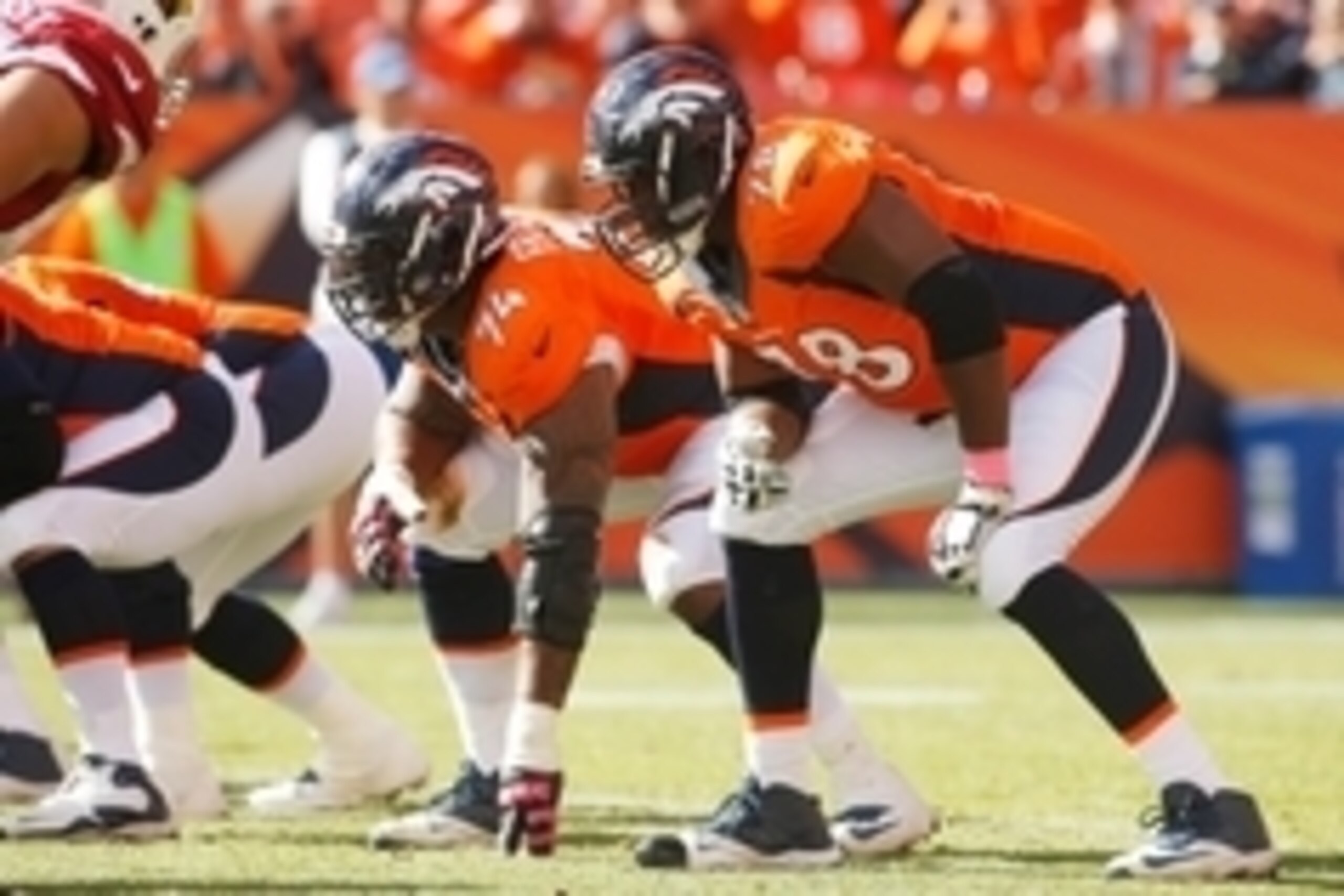 Oct 5, 2014; Denver, CO, USA; Denver Broncos tackle Ryan Clady (78) and guard Orlando Franklin (74) during the game against the Arizona Cardinals at Sports Authority Field at Mile High. Mandatory Credit: Chris Humphreys-USA TODAY Sports