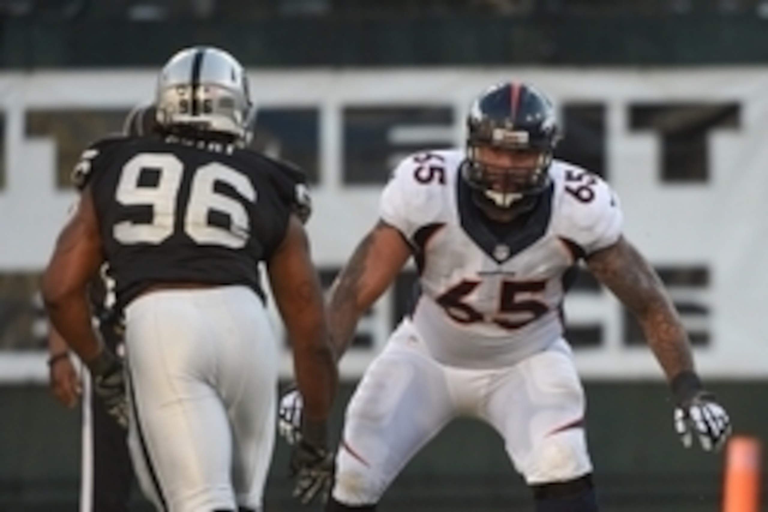 November 9, 2014; Oakland, CA, USA; Denver Broncos guard Louis Vasquez (65) blocks Oakland Raiders defensive end Denico Autry (96) during the fourth quarter at O.co Coliseum. The Broncos defeated the Raiders 41-17. Mandatory Credit: Kyle Terada-USA TODAY 