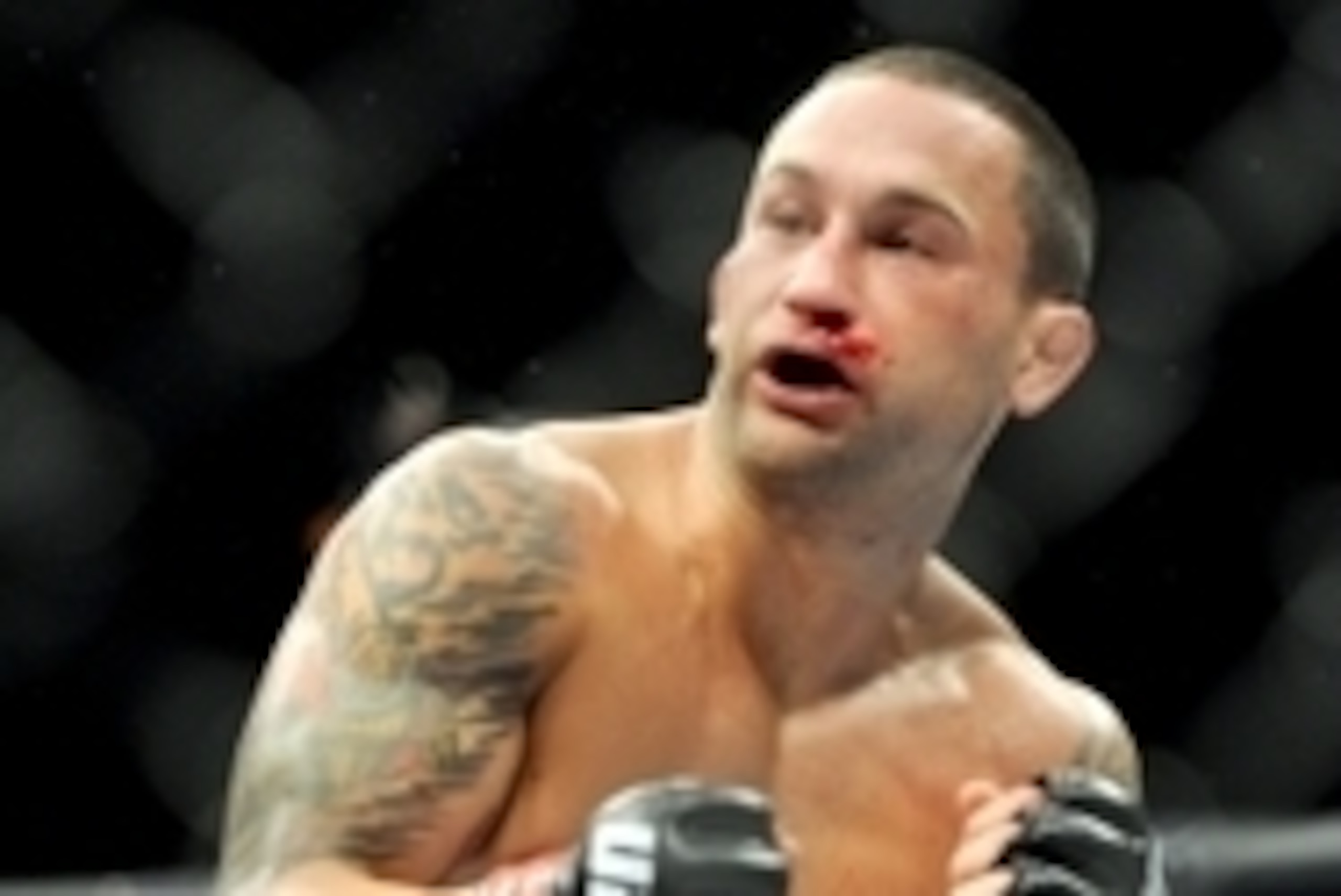 Jul 6, 2013; Las Vegas, NV, USA;  Frankie Edgar (red gloves) during his Featherweight Bout  against Charles Oliveira (not pictured) at the MGM Grand Garden Arena. Edgar won. Mandatory Credit: Jayne Kamin-Oncea-USA TODAY Sports