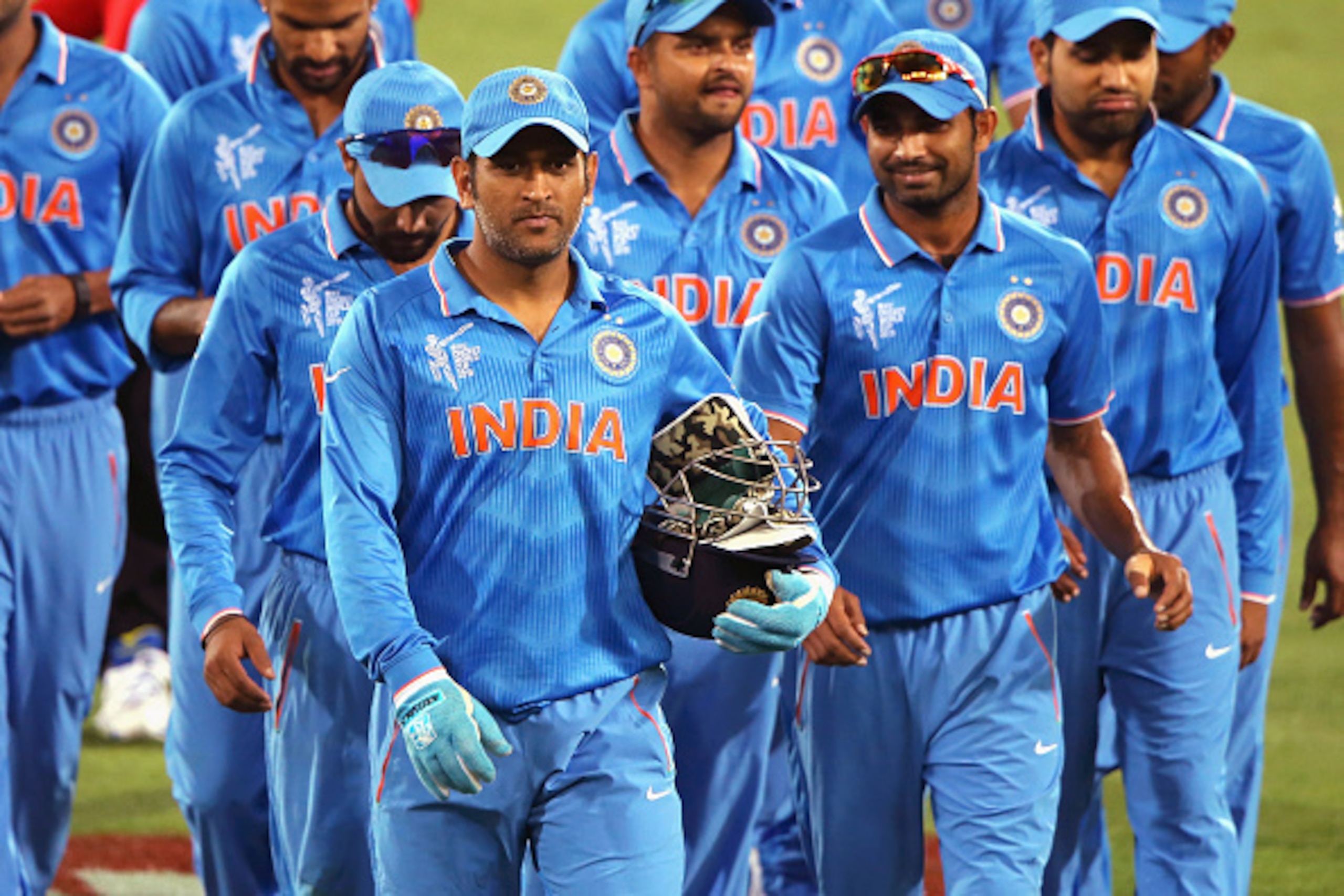 ADELAIDE, AUSTRALIA - FEBRUARY 10: MS Dhoni of India leads the team off the field after the 2015 ICC Cricket World Cup warm up match between India and Afghanistan at Adelaide Oval on February 10, 2015 in Adelaide, Australia.  (Photo by Daniel Kalisz/Getty
