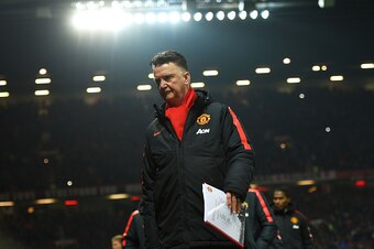 MANCHESTER, ENGLAND - FEBRUARY 11: Louis van Gaal, manager of Manchester United takes his seat during the Barclays Premier League match between Manchester United and Burnley at Old Trafford on February 11, 2015 in Manchester, England.  (Photo by Michael R