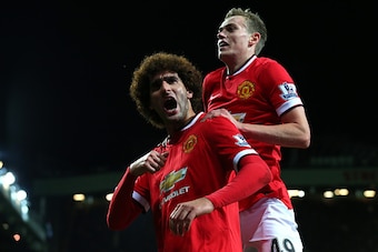 MANCHESTER, ENGLAND - DECEMBER 02:  Marouane Fellaini of Manchester United  celebrates scoring the first goal during the Barclays Premier League match between Manchester United and Stoke City at Old Trafford on December 2, 2014 in Manchester, England.  (P
