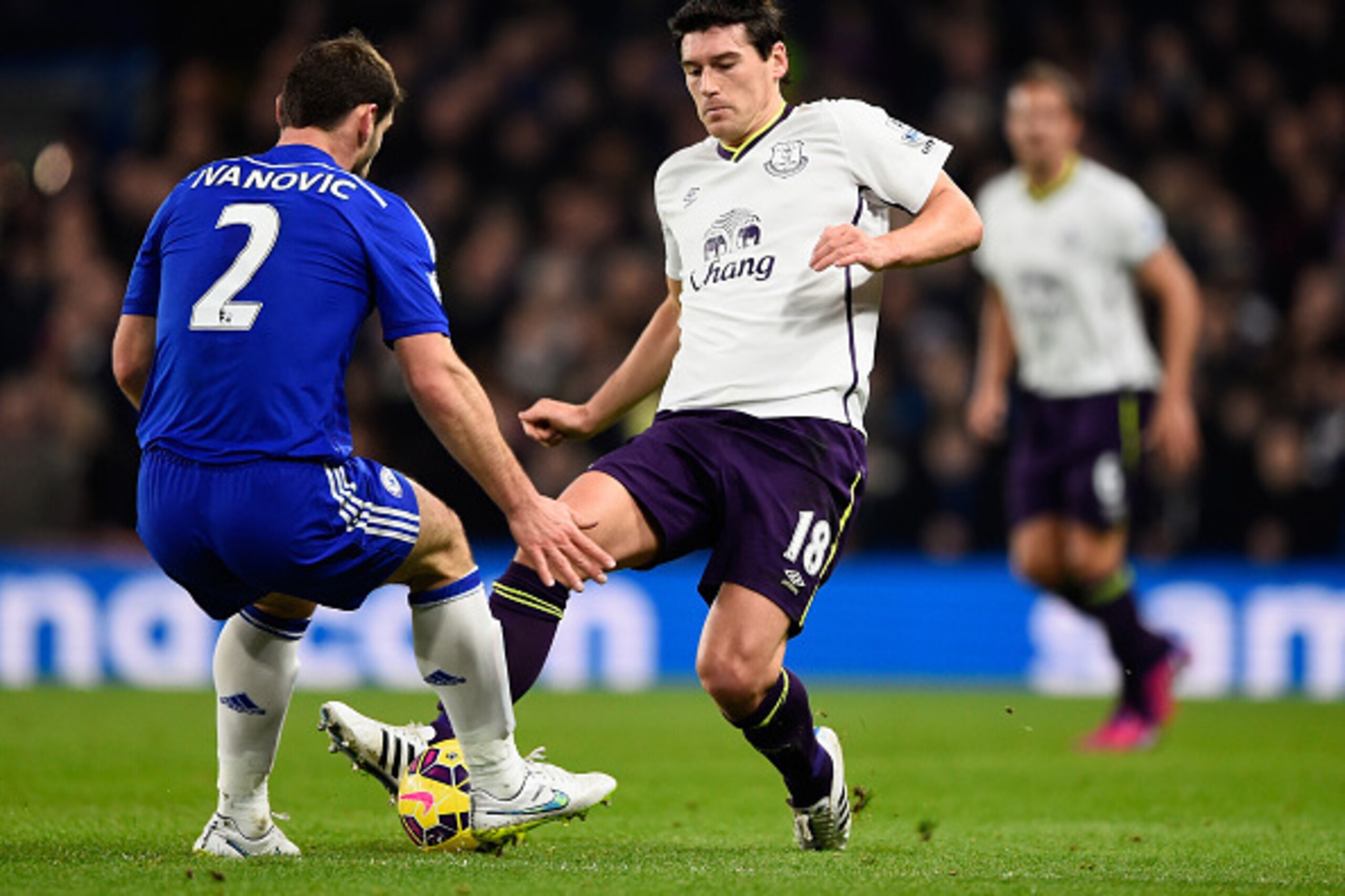 LONDON, ENGLAND - FEBRUARY 11:  Branislav Ivanovic of Chelsea tackles Gareth Barry of Everton during the Barclays Premier League match between Chelsea and Everton at Stamford Bridge on February 11, 2015 in London, England.  (Photo by Mike Hewitt/Getty Ima