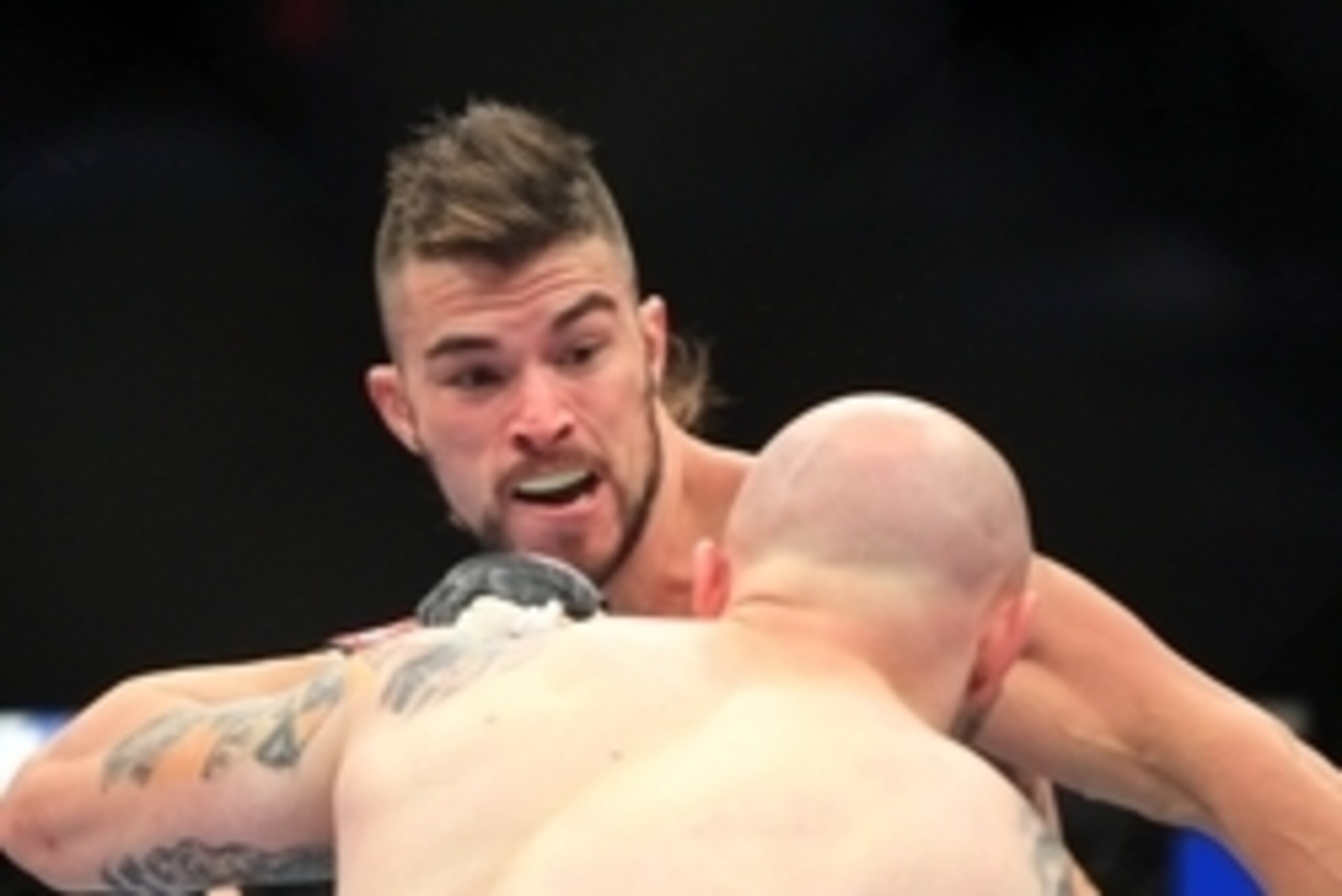 Aug 27, 2013; Indianapolis, IN, USA; Justin Edwards (front) fights Brandon Thatch during UFC Fight Night 27 at Bankers Life Fieldhouse. Mandatory Credit: Pat Lovell-USA TODAY Sports