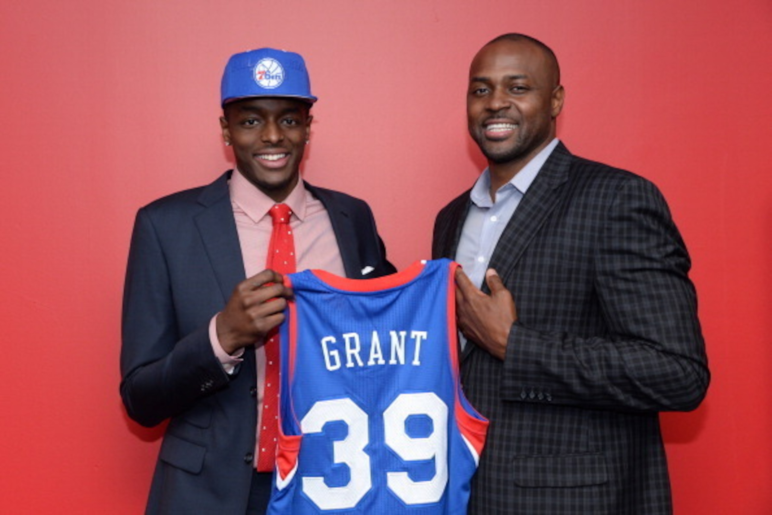 PHILADELPHIA, PA - JUNE 28:  Jerami Grant #39 of the Philadelphia 76ers poses for a photo with his father, former NBA player Harvey Grant, after being drafted by the Philadelphia 76ers at the Wells Fargo Center on June 28, 2014 in the Philadelphia, Pennsy