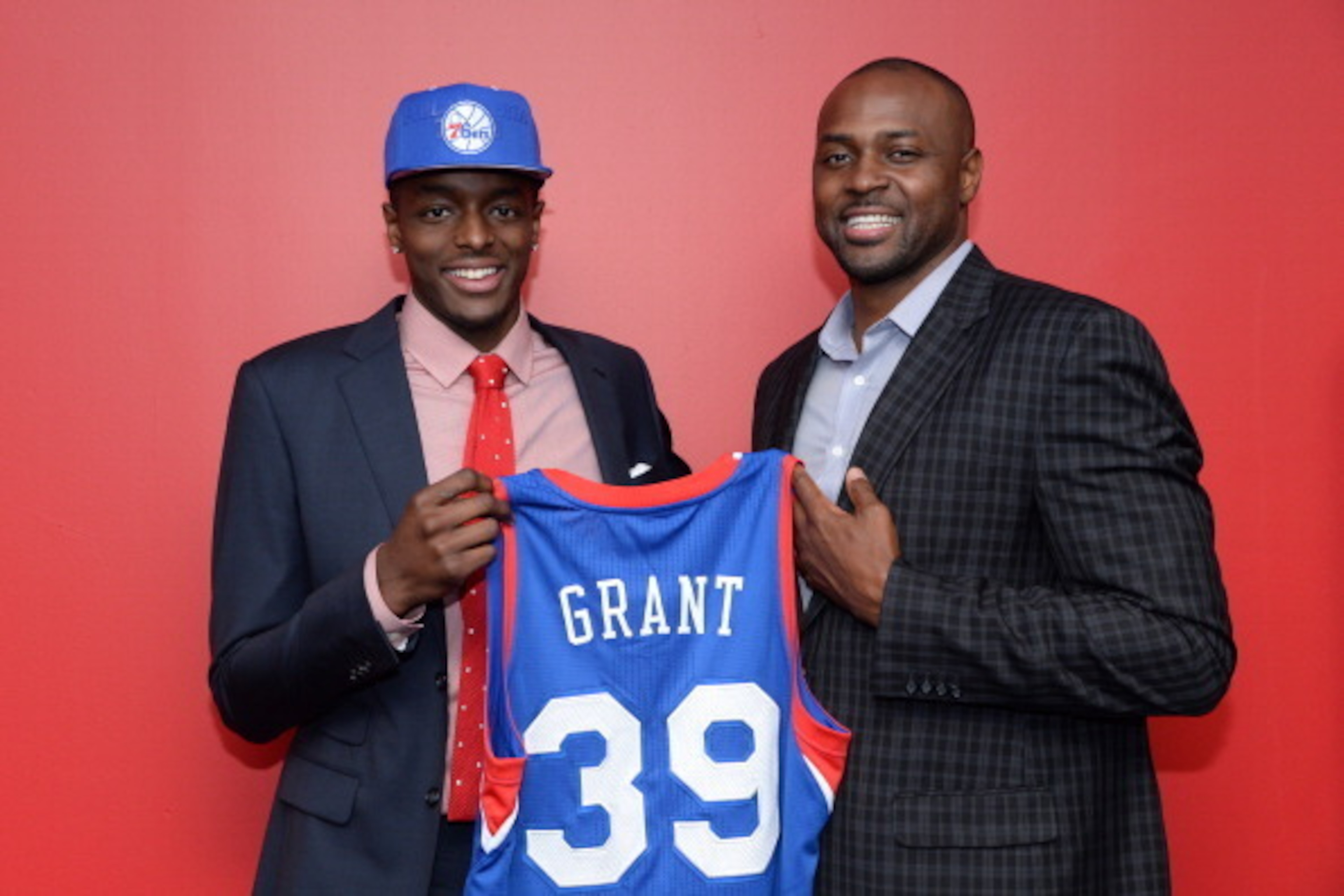 PHILADELPHIA, PA - JUNE 28:  Jerami Grant #39 of the Philadelphia 76ers poses for a photo with his father, former NBA player Harvey Grant, after being drafted by the Philadelphia 76ers at the Wells Fargo Center on June 28, 2014 in the Philadelphia, Pennsy