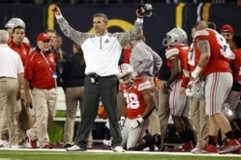 Jan 12, 2015; Arlington, TX, USA; Ohio State Buckeyes head coach Urban Meyer celebrates during the fourth quarter against the Oregon Ducks in the 2015 CFP National Championship Game at AT&T Stadium. Mandatory Credit: Tim Heitman-USA TODAY Sports