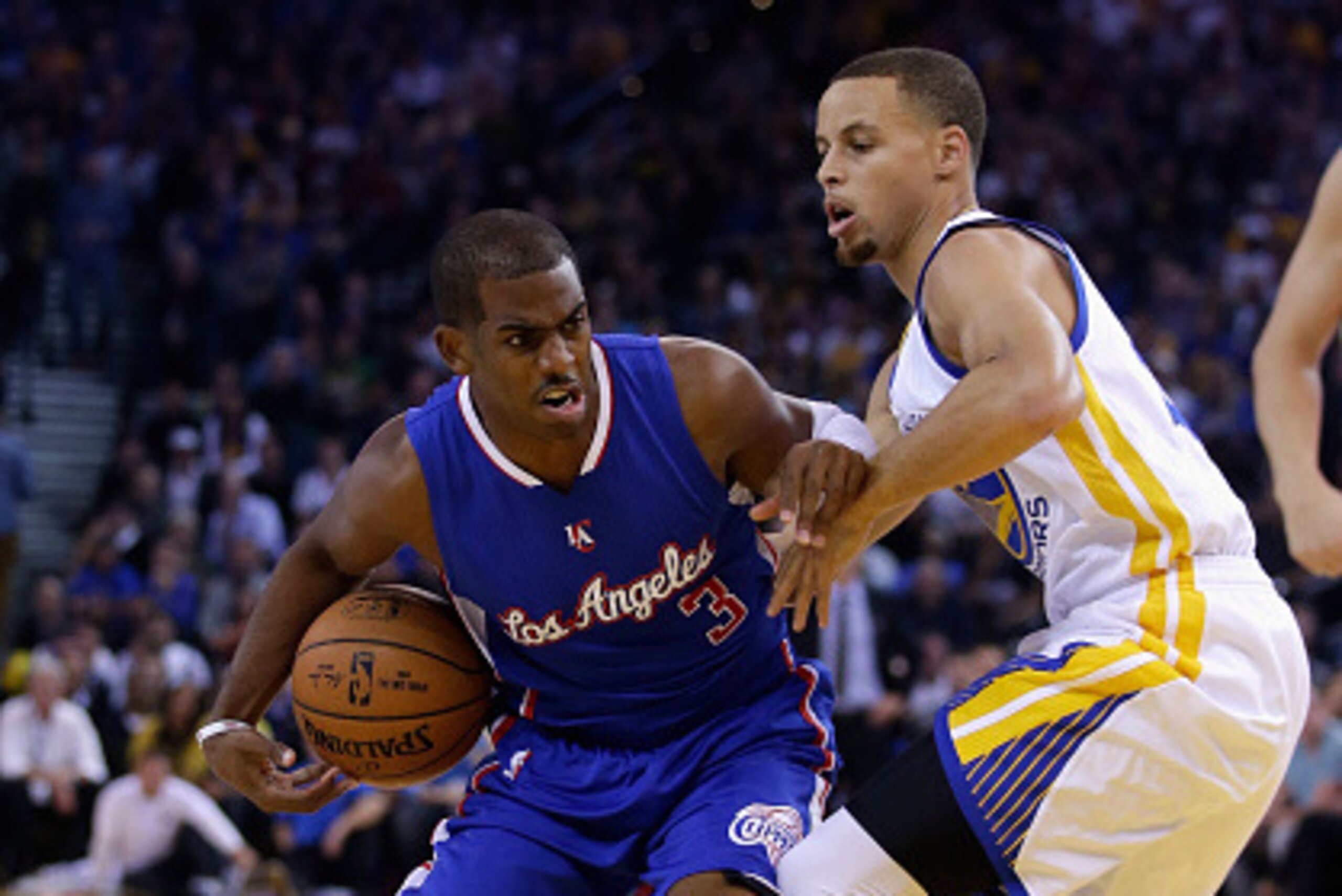 OAKLAND, CA - NOVEMBER 05: Chris Paul #3 of the Los Angeles Clippers drives past Stephen Curry #30 of the Golden State Warriors at ORACLE Arena on November 5, 2014 in Oakland, California. NOTE TO USER: User expressly acknowledges and agrees that, by down OAKLAND, CA - NOVEMBER 05: Chris Paul #3 of the Los Angeles Clippers drives past Stephen Curry #30 of the Golden State Warriors at ORACLE Arena on November 5, 2014 in Oakland, California. NOTE TO USER: User expressly acknowledges and agrees that, by down