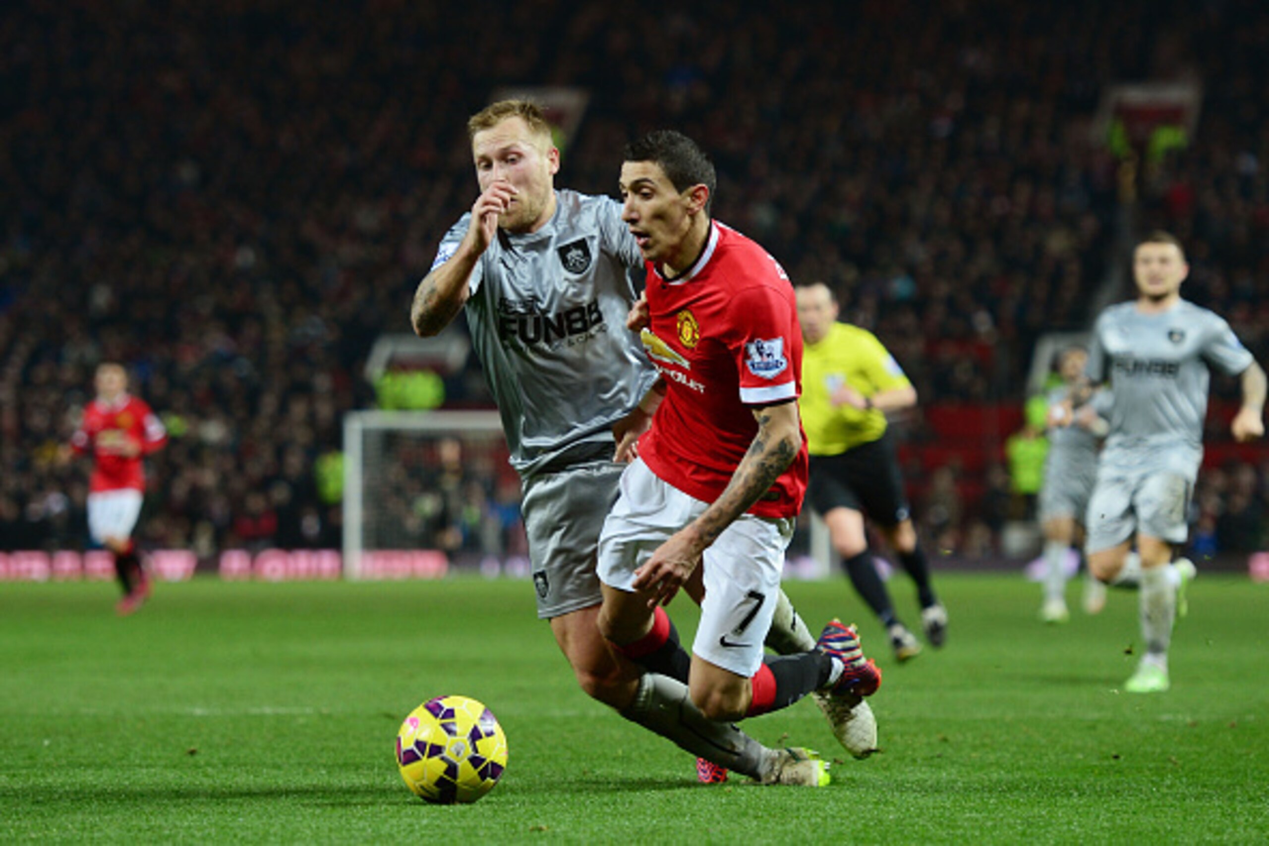 MANCHESTER, ENGLAND - FEBRUARY 11:  Angel Di Maria of Manchester United is brought down by Scott Arfield of Burnley leading to a penalty during the Barclays Premier League match between Manchester United and Burnley at Old Trafford on February 11, 2015 in