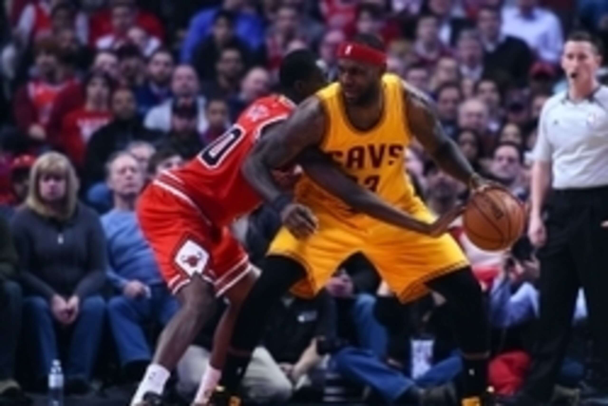 Feb 12, 2015; Chicago, IL, USA; Chicago Bulls forward Tony Snell (20) knocks the ball away from Cleveland Cavaliers forward LeBron James (23) during the second quarter at the United Center. Mandatory Credit: Mike DiNovo-USA TODAY Sports