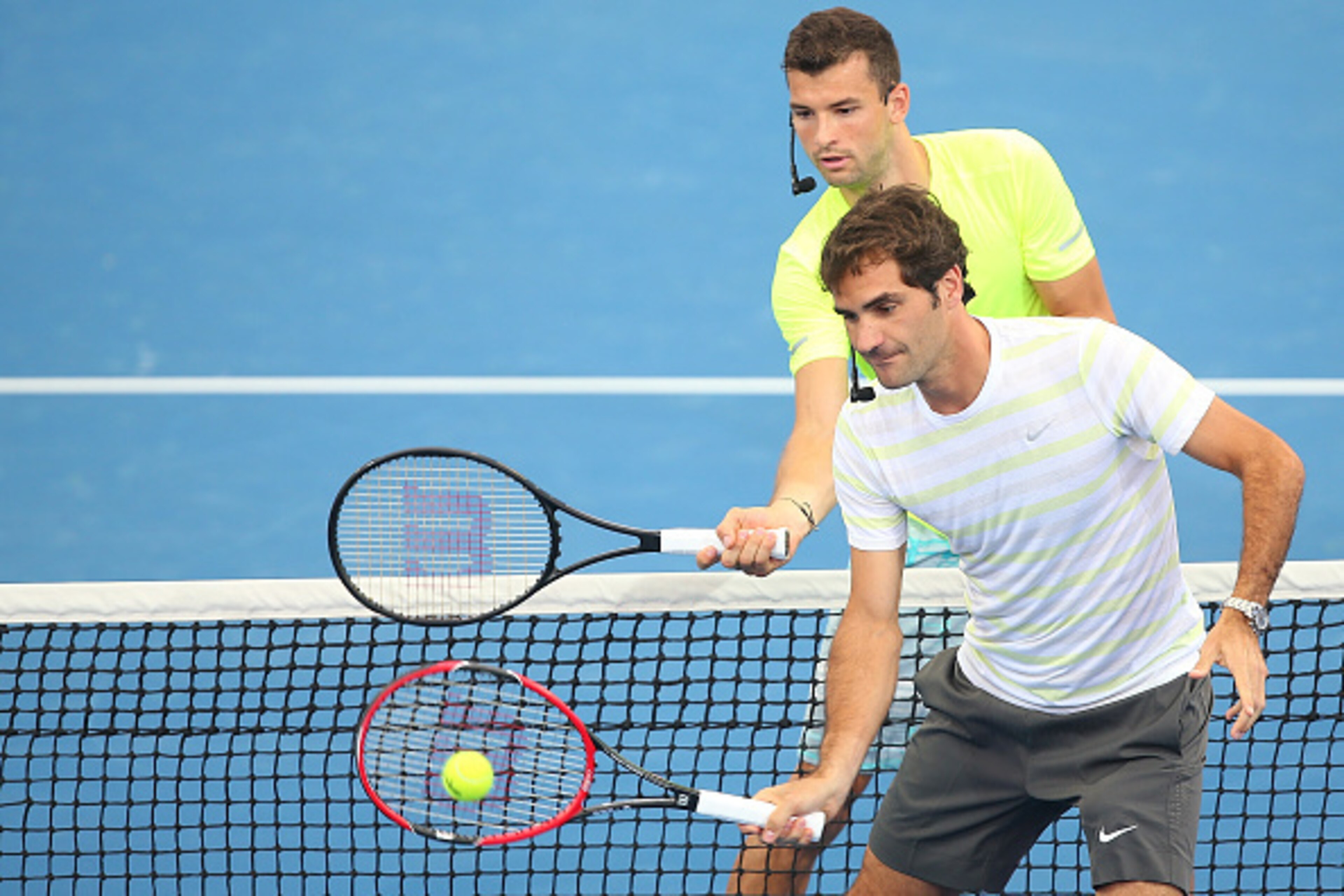 BRISBANE, AUSTRALIA - JANUARY 04:   Roger Federer and Grigor Dimitrov take part in the Pat Rafter Arena Spectacular during day one of the 2015 Brisbane International at Pat Rafter Arena on January 4, 2015 in Brisbane, Australia.  (Photo by Chris Hyde/Gett